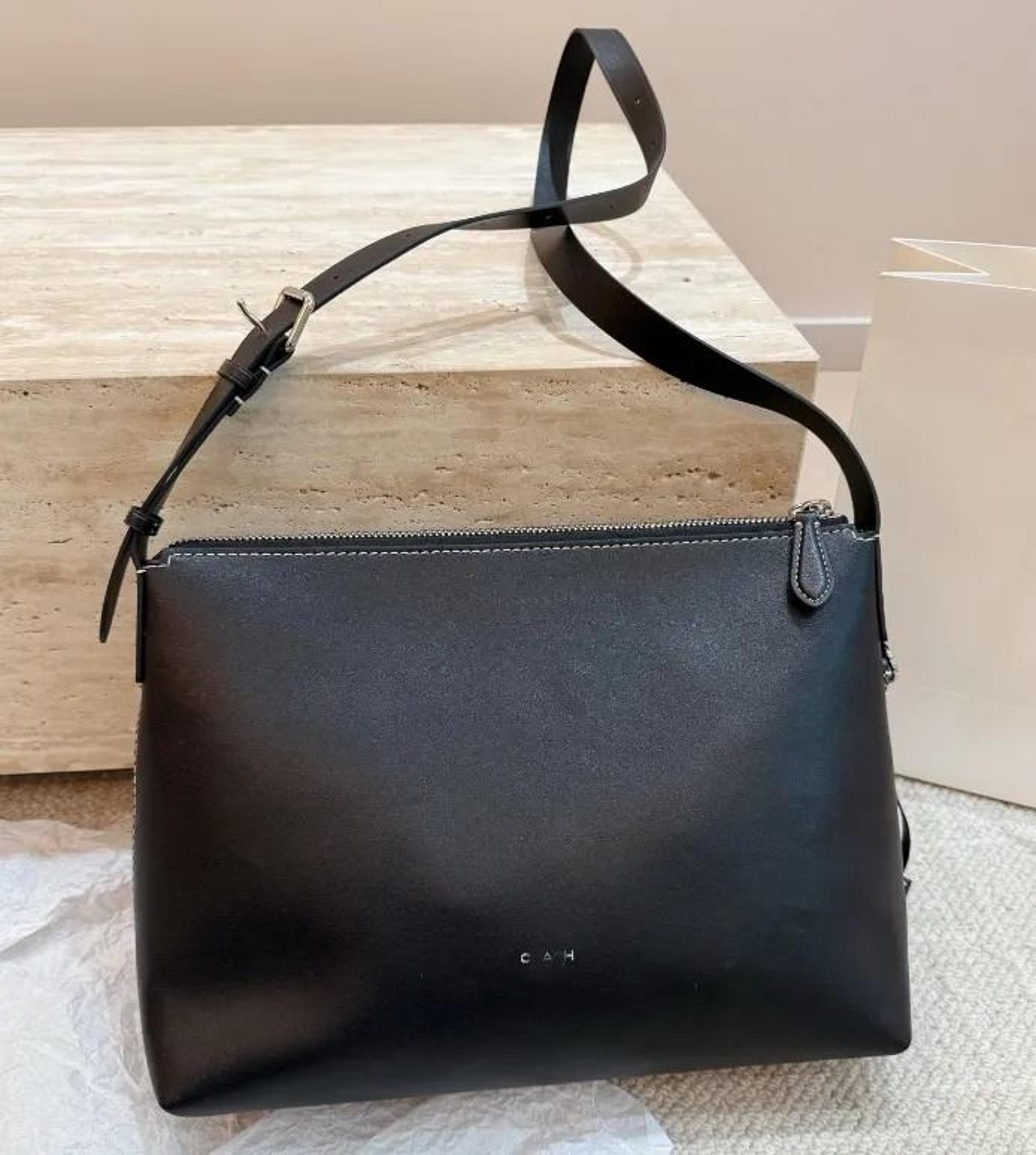 genuine leather crossbody shoulder bag with adjustable strap and flap closure