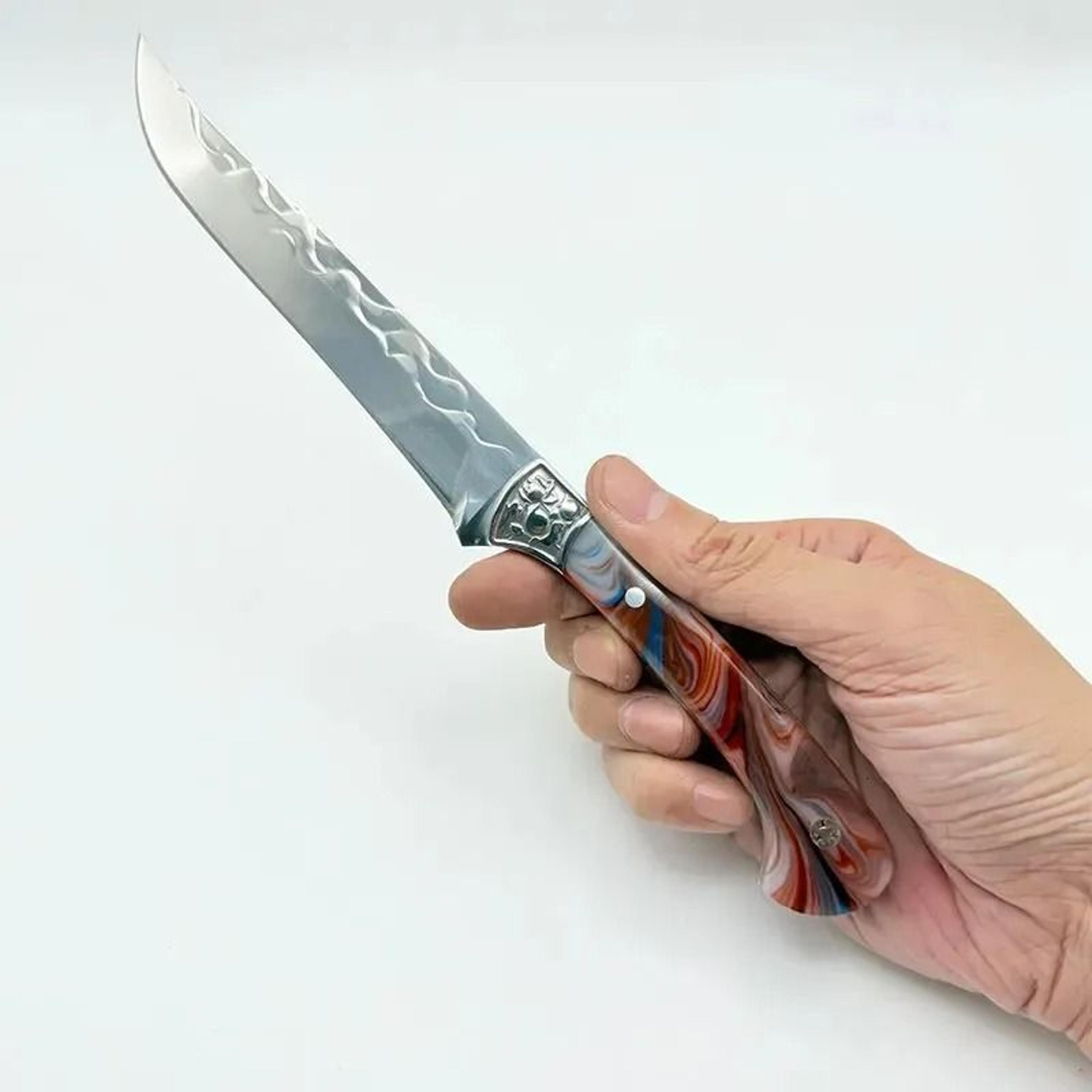 hand forged boning knife with resin handle and protective scabbard