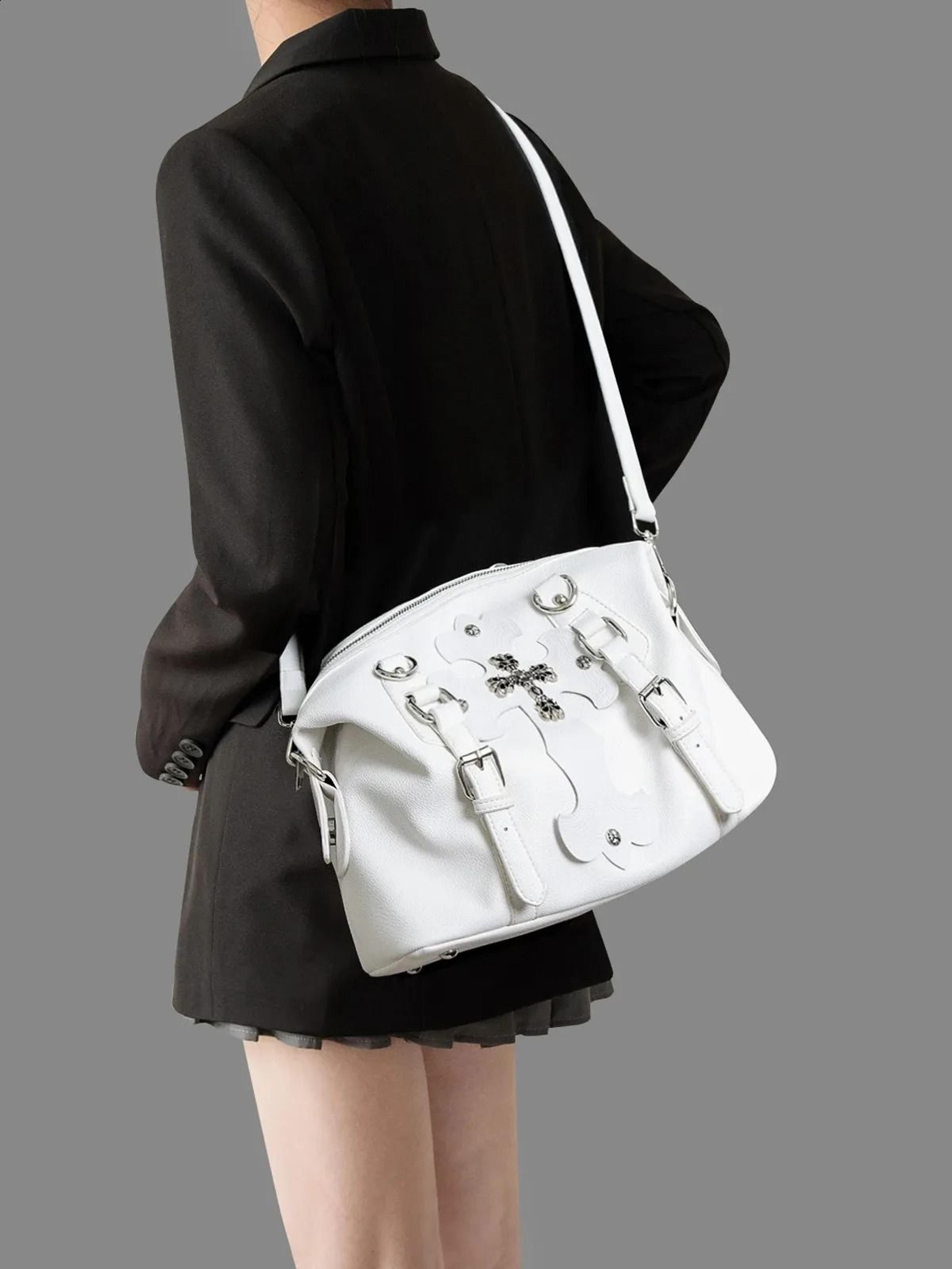 retro crossbody backpack with white metal accents and adjustable strap