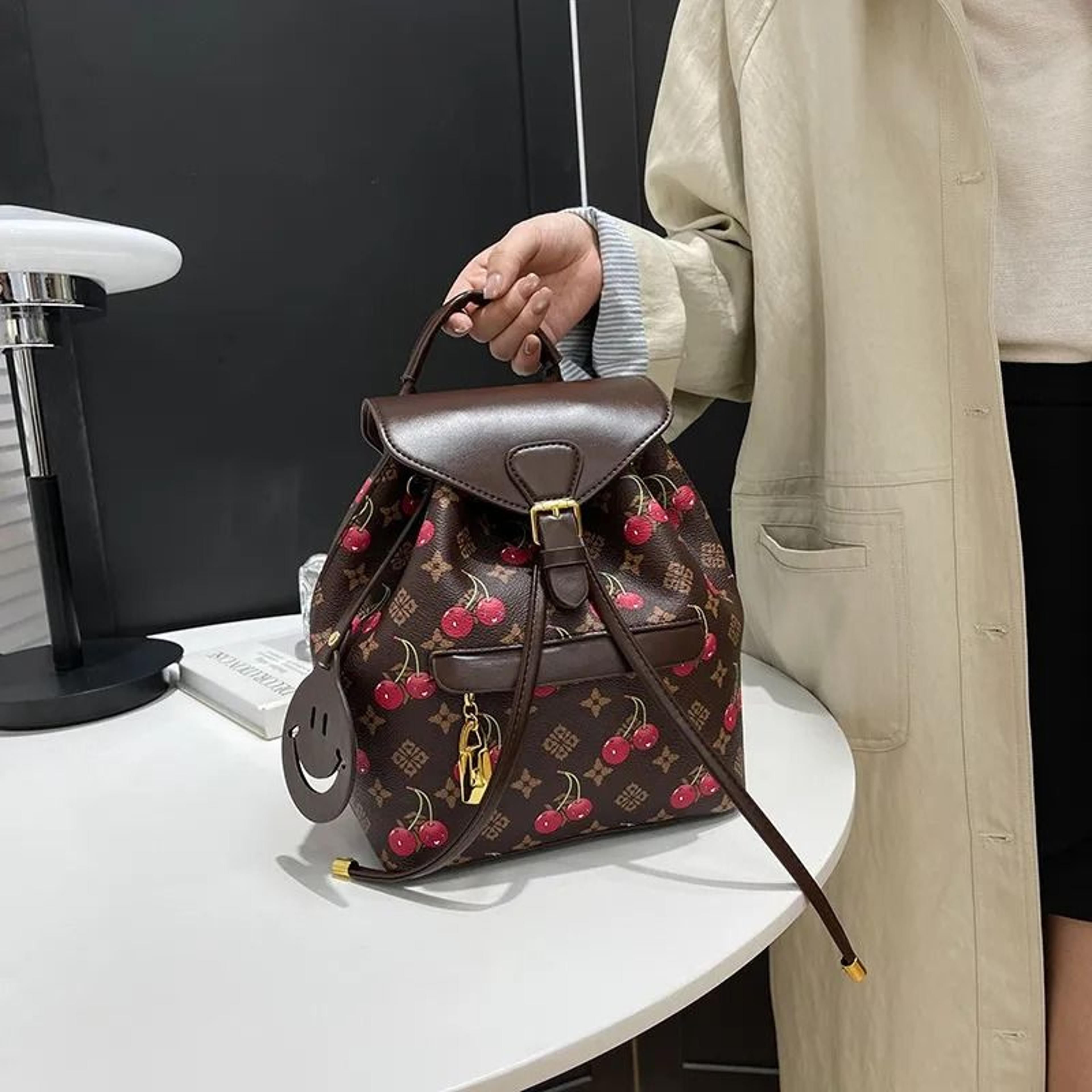 women large capacity travel backpack brown white color contrast print daypack