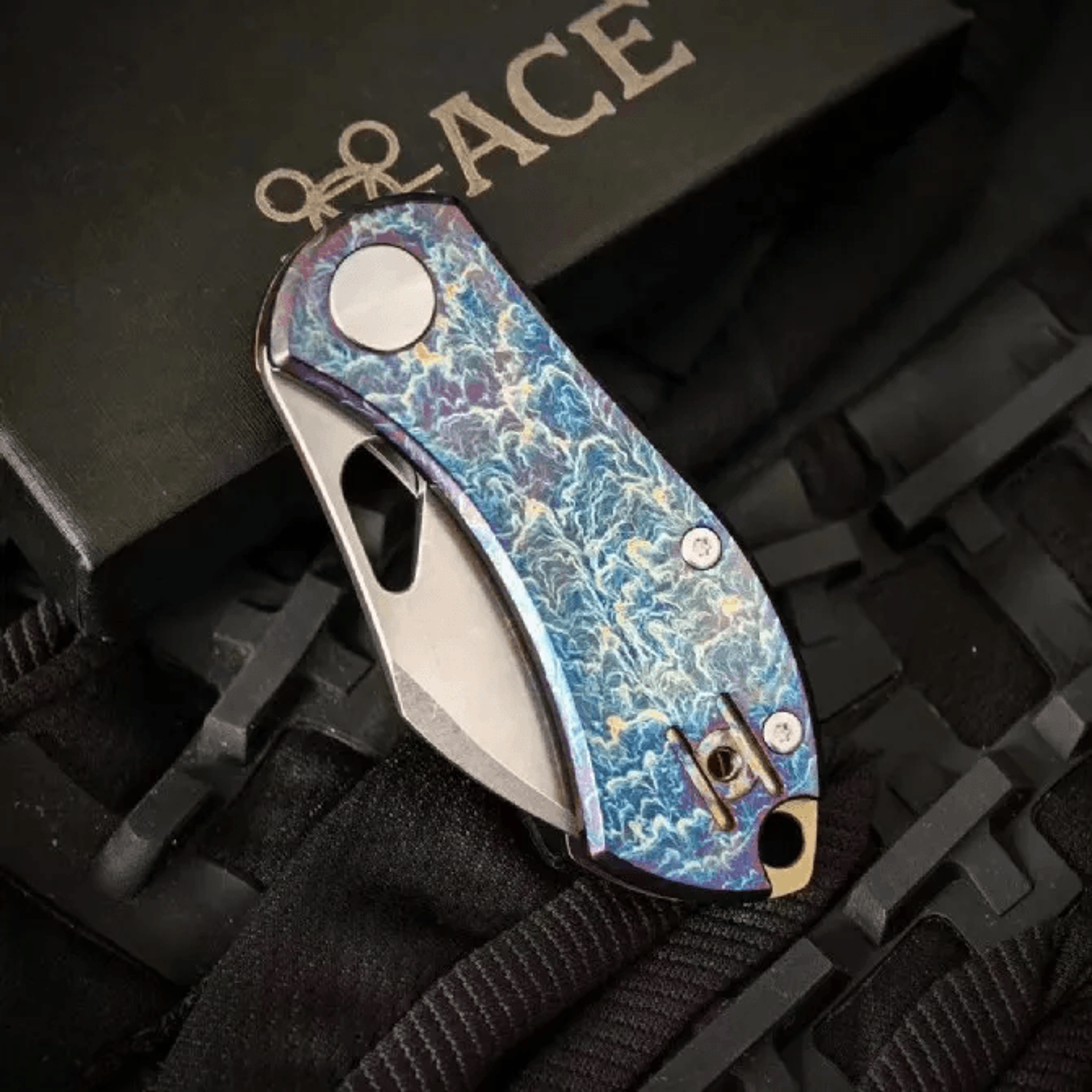 high end folding knife with satin tanto blade and titanium alloy handle