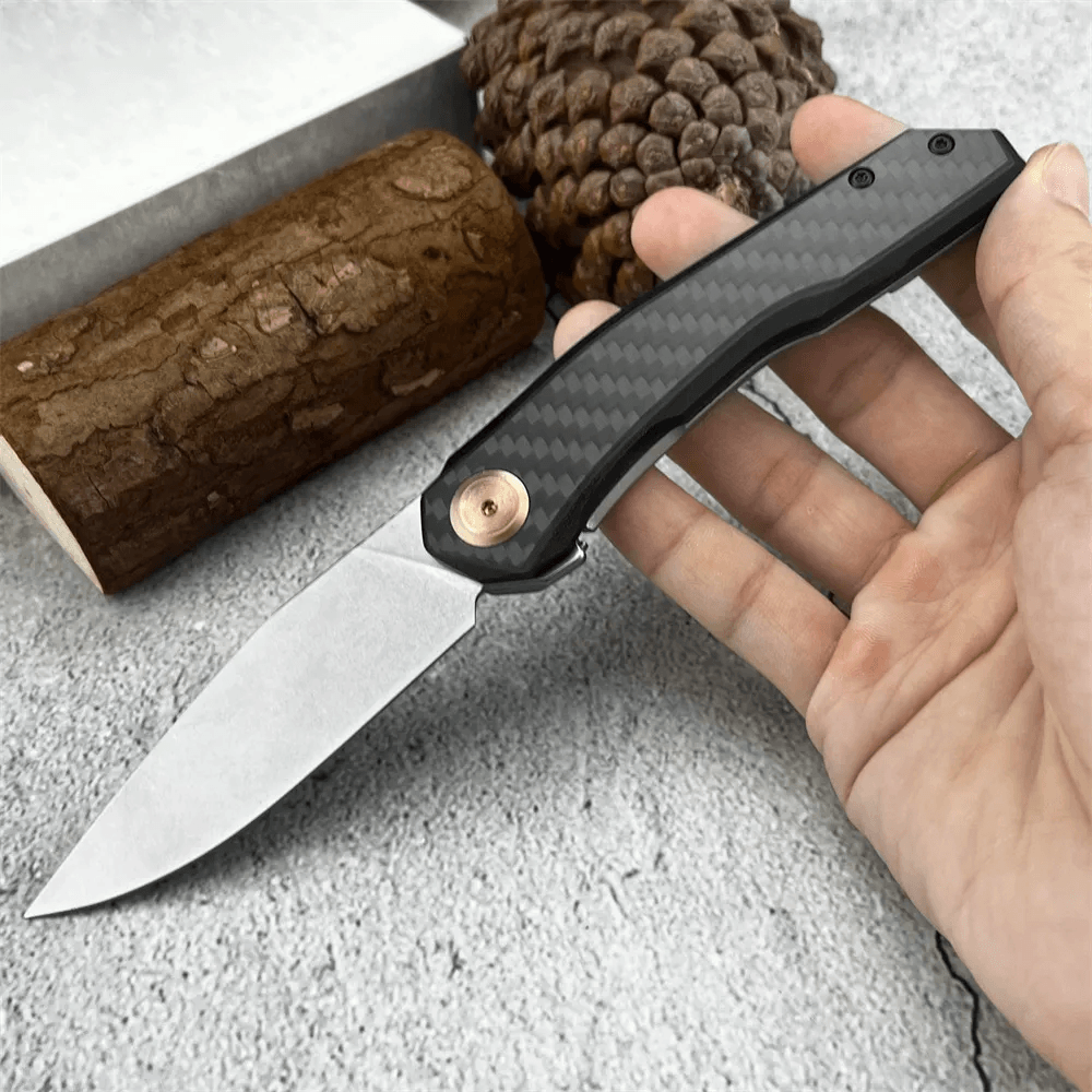 steel flipper folding knife with carbon fiber and steel handle