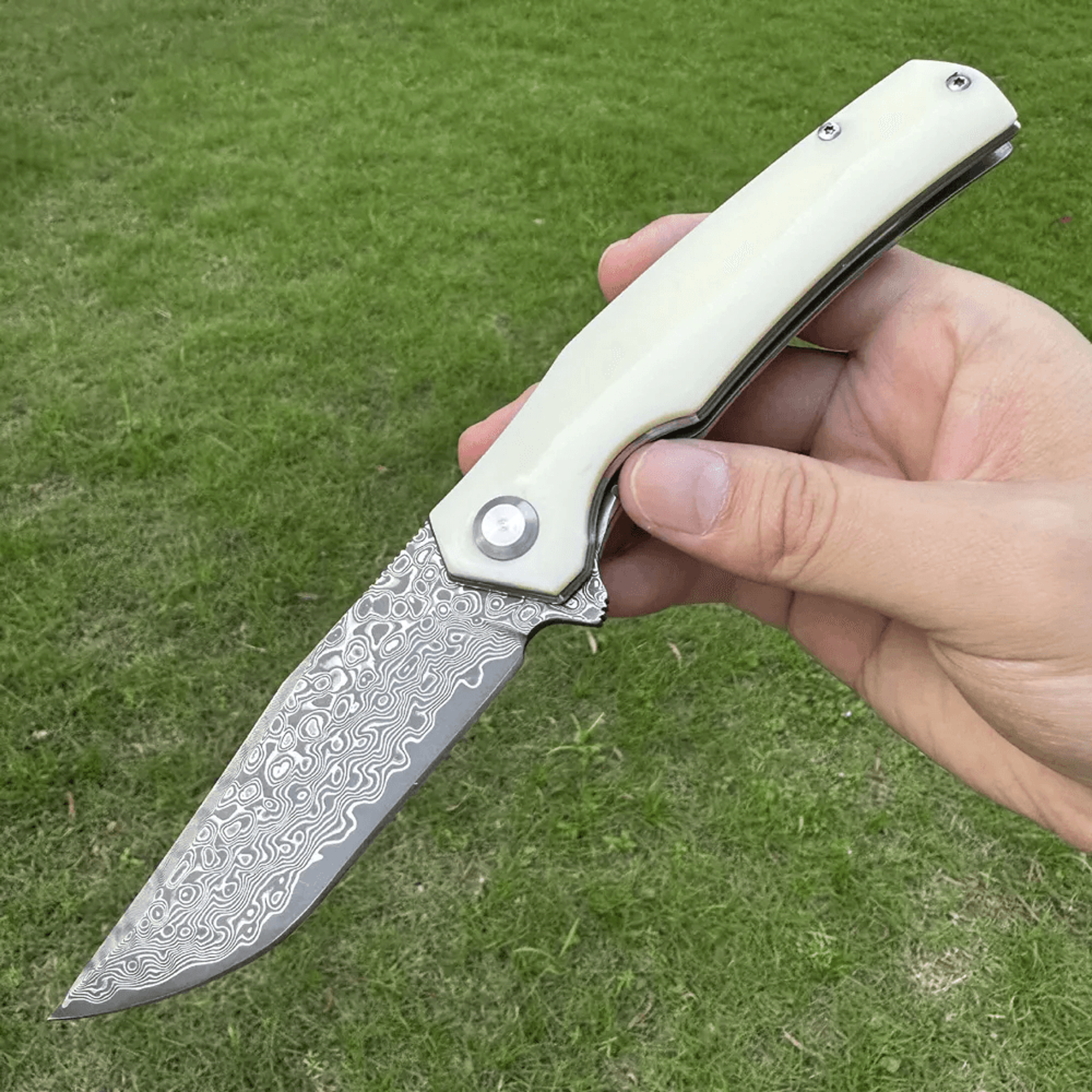 damascus steel flipper folding knife with resin handle