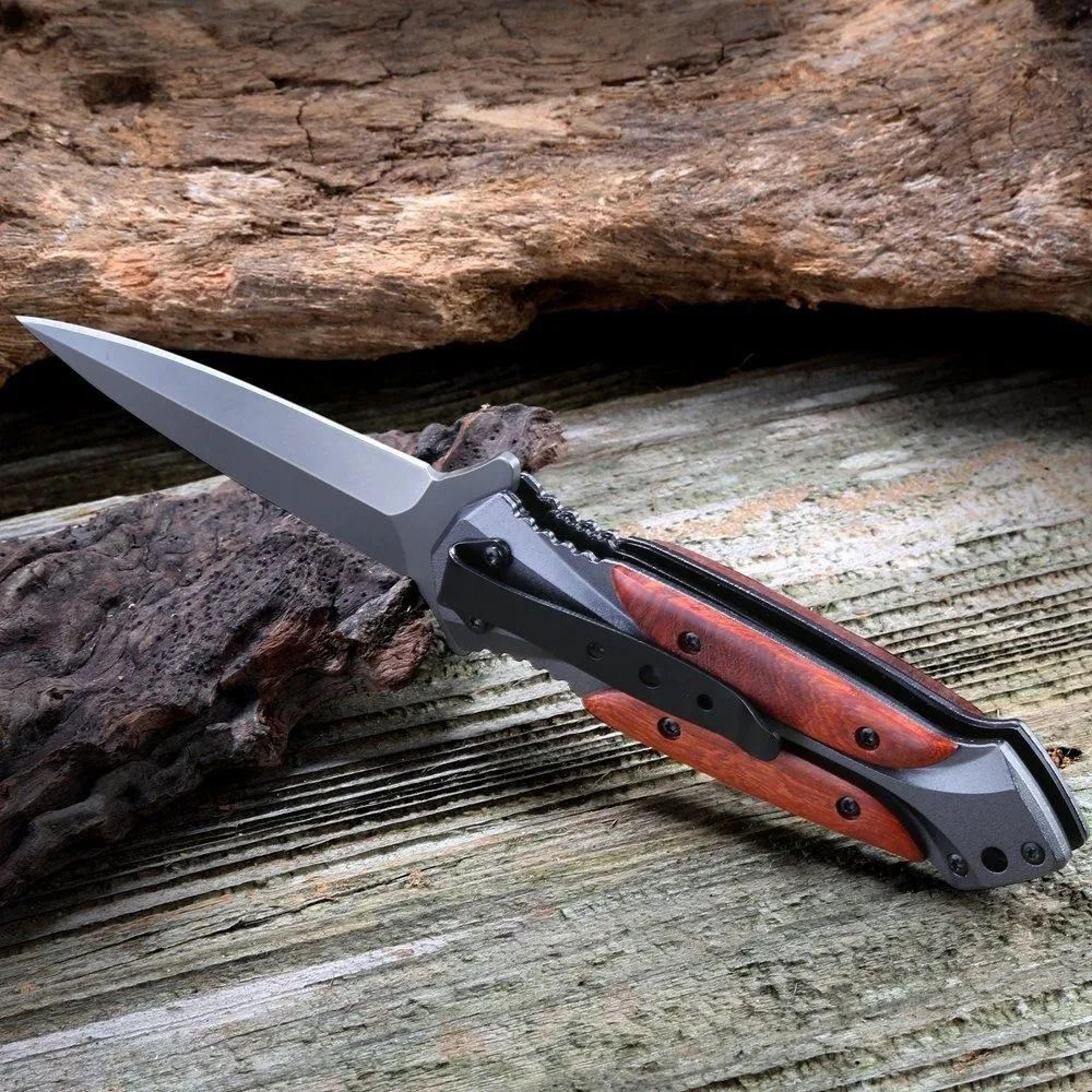 tactical folding knife with stainless steel blade and locking mechanism