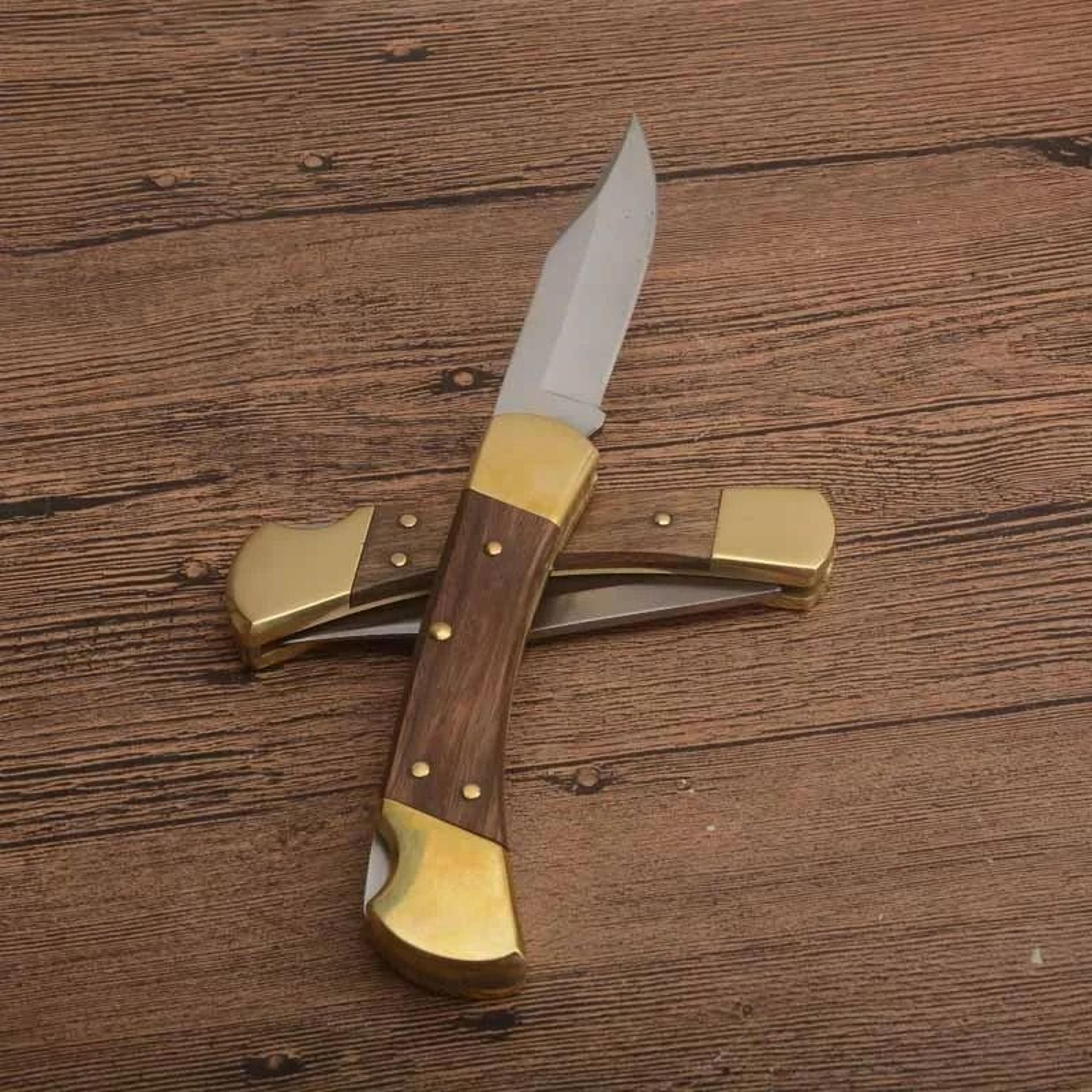 folding pocket knife with wood and brass handle and leather sheath