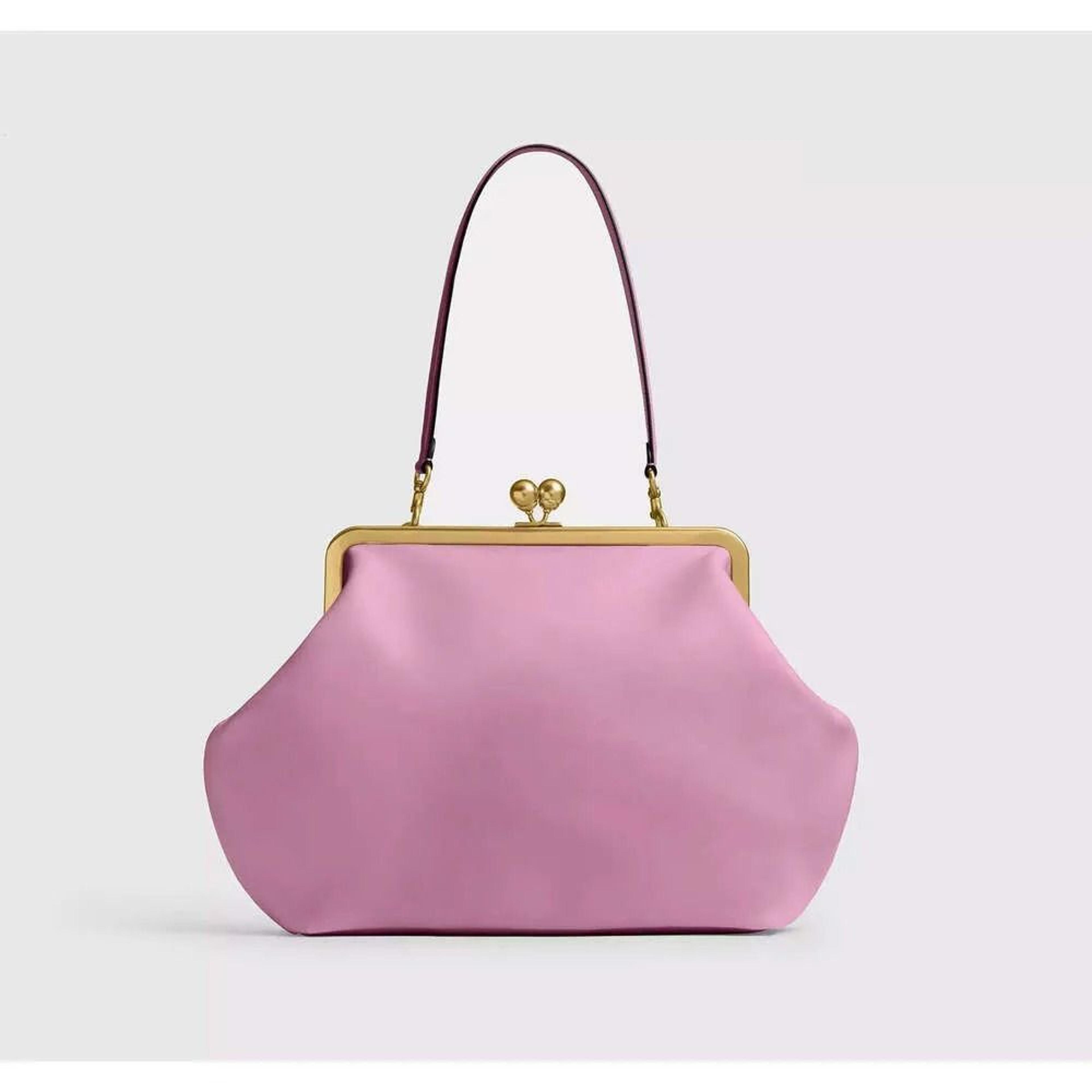 pink synthetic leather tote bag with kiss lock clasp