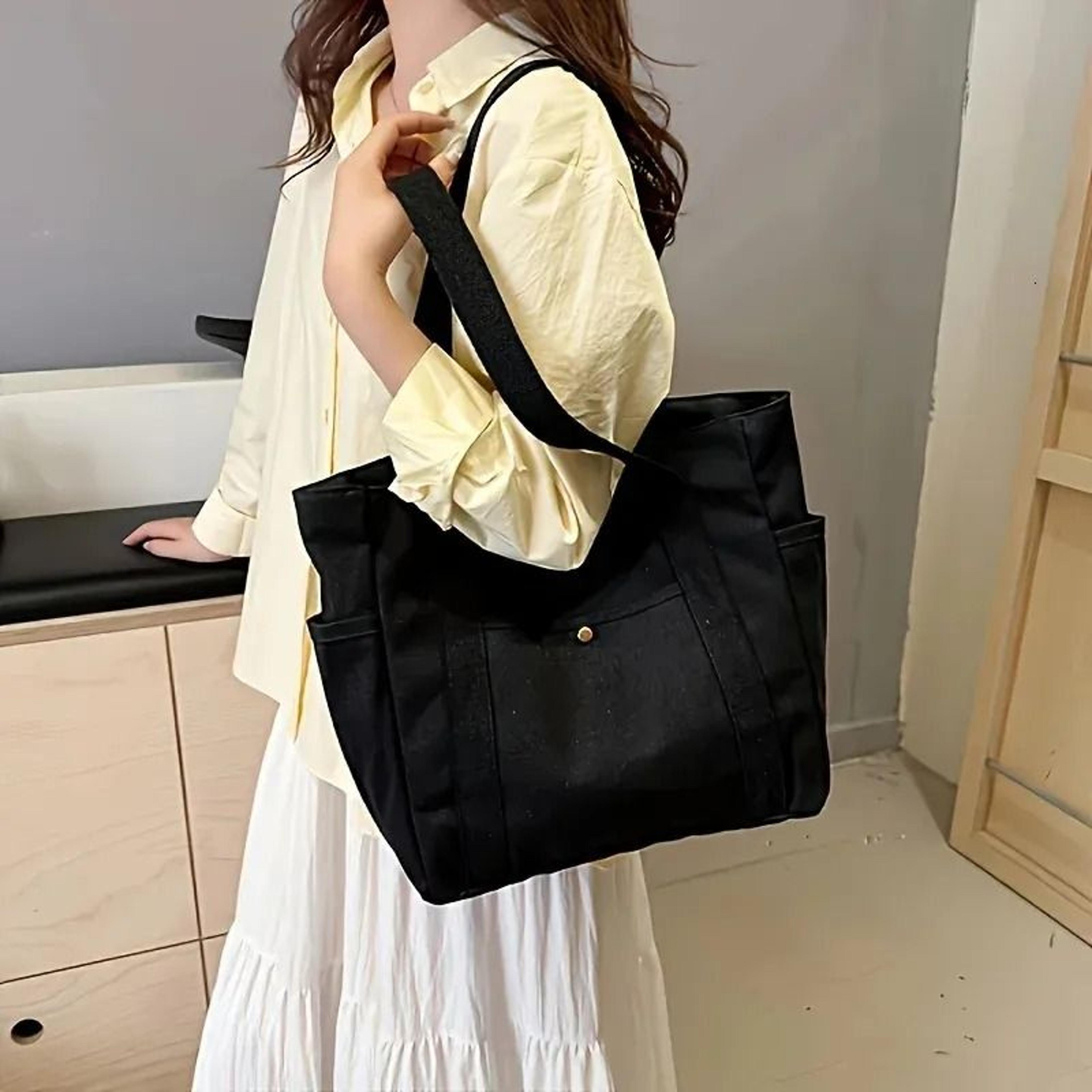 large capacity canvas tote bag with zipper closure and reinforced shoulder straps