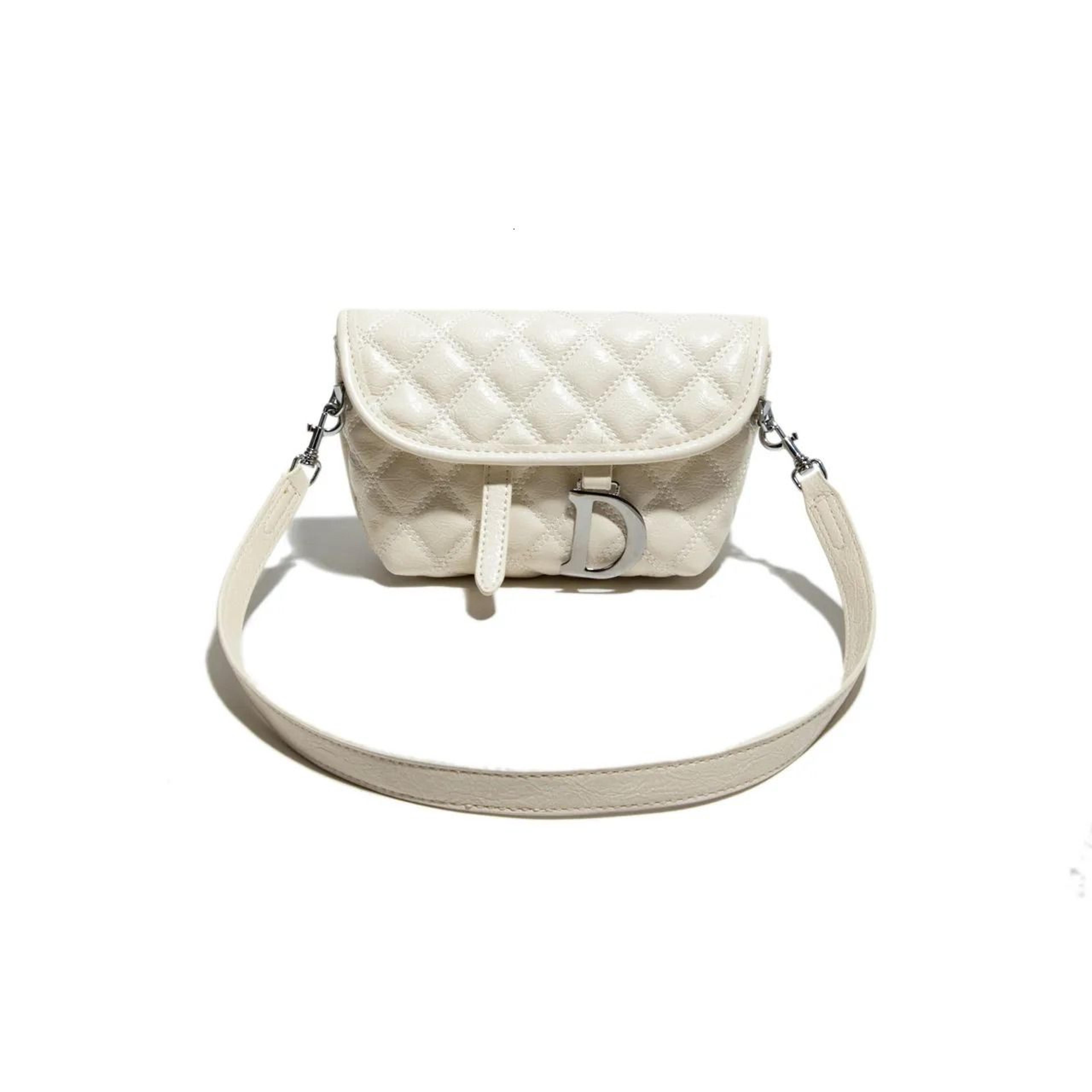 womens quilted leather saddle bag with d-shaped buckle and adjustable crossbody strap