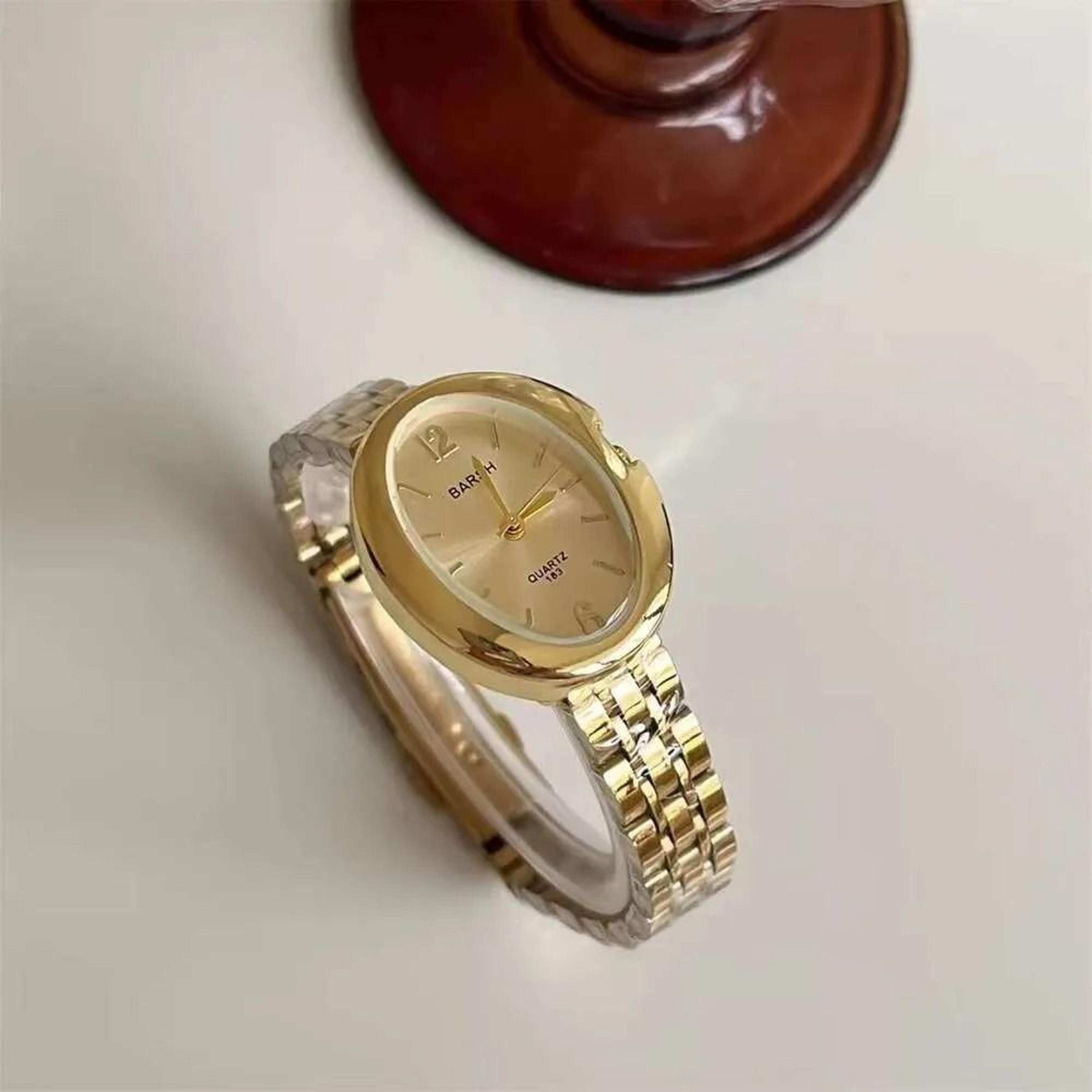women vintage gold watch with stainless steel band and quartz movement