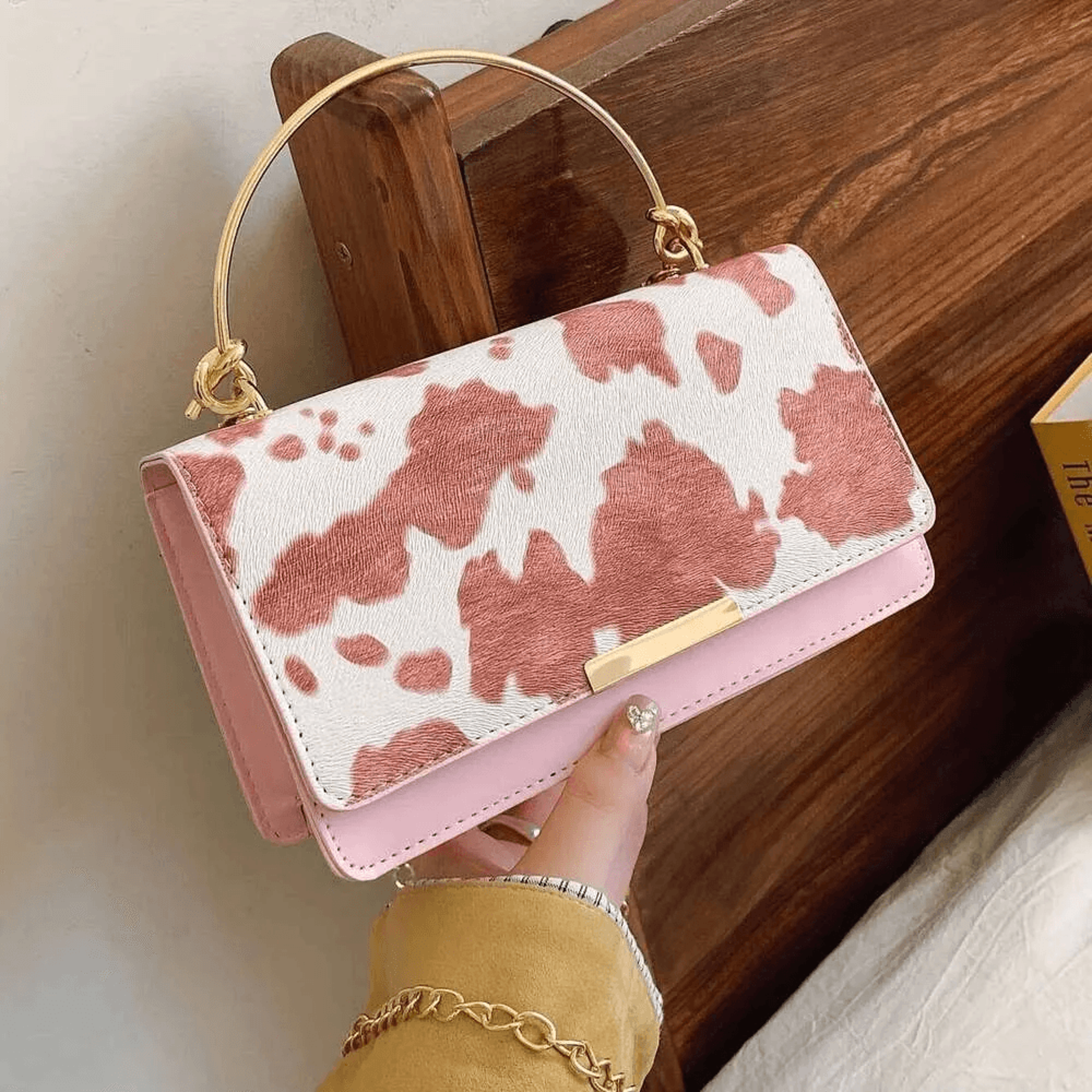 cow print handheld crossbody bag with detachable chain strap