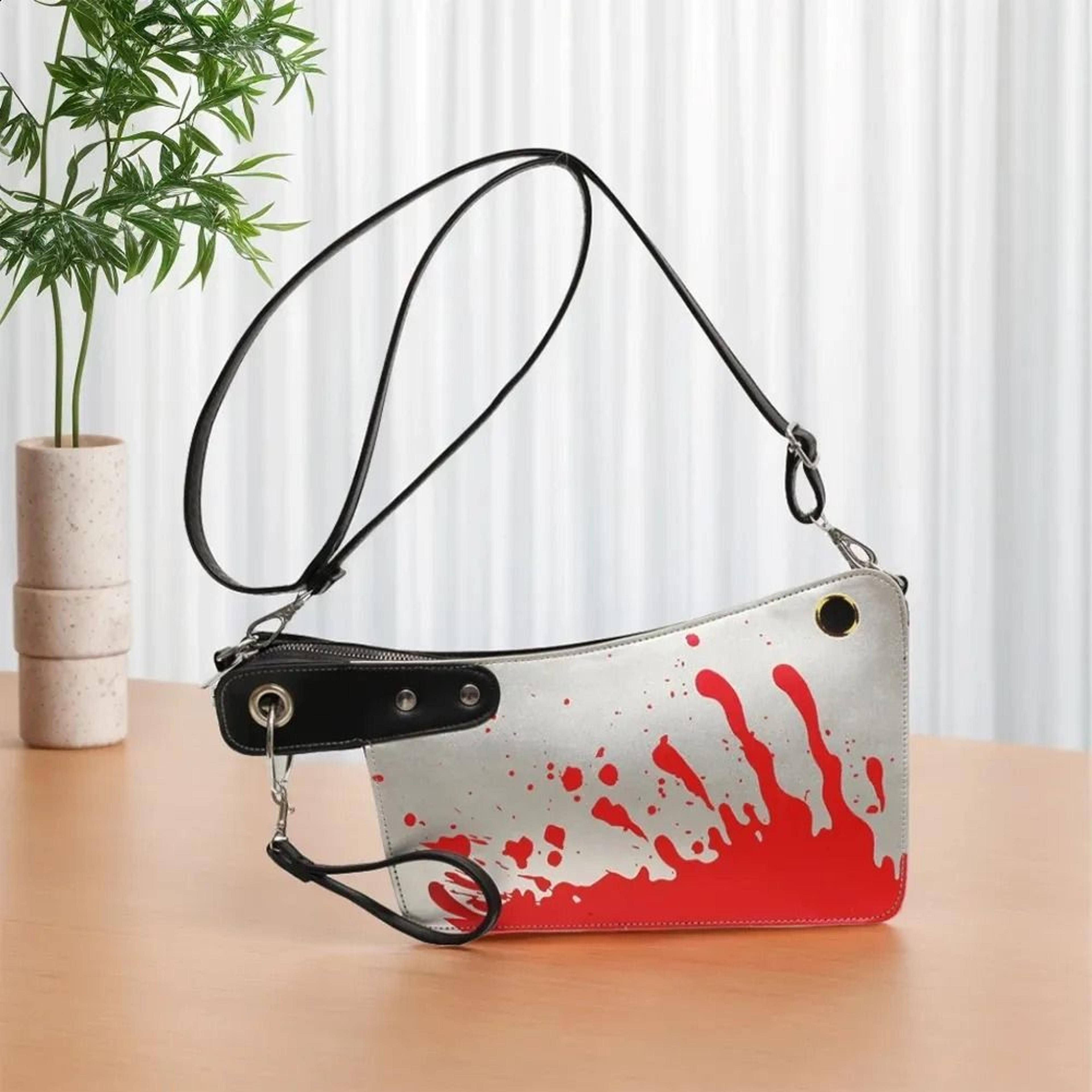 gothic knife shaped crossbody bag with adjustable strap