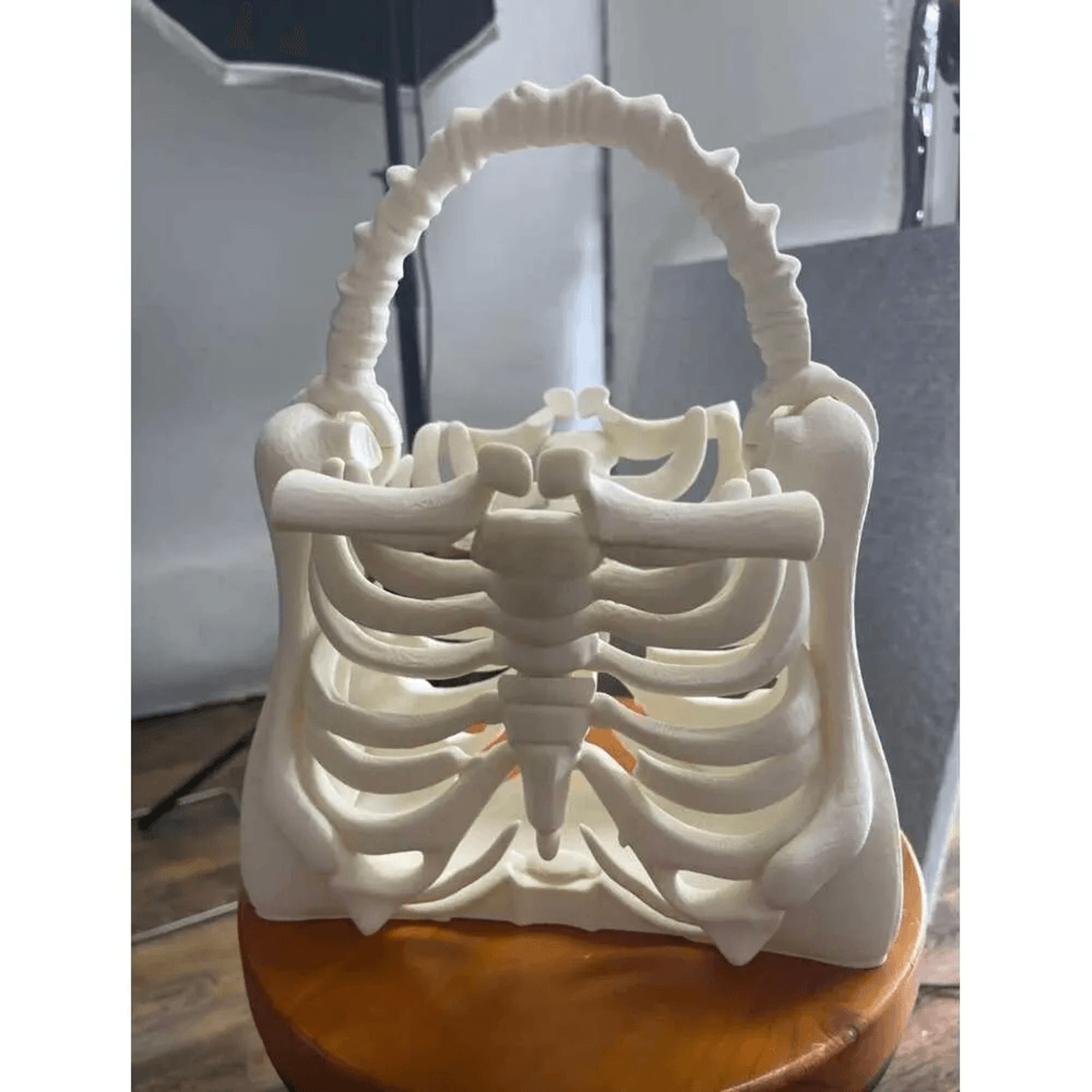 skull handbag with adjustable strap and zip closure