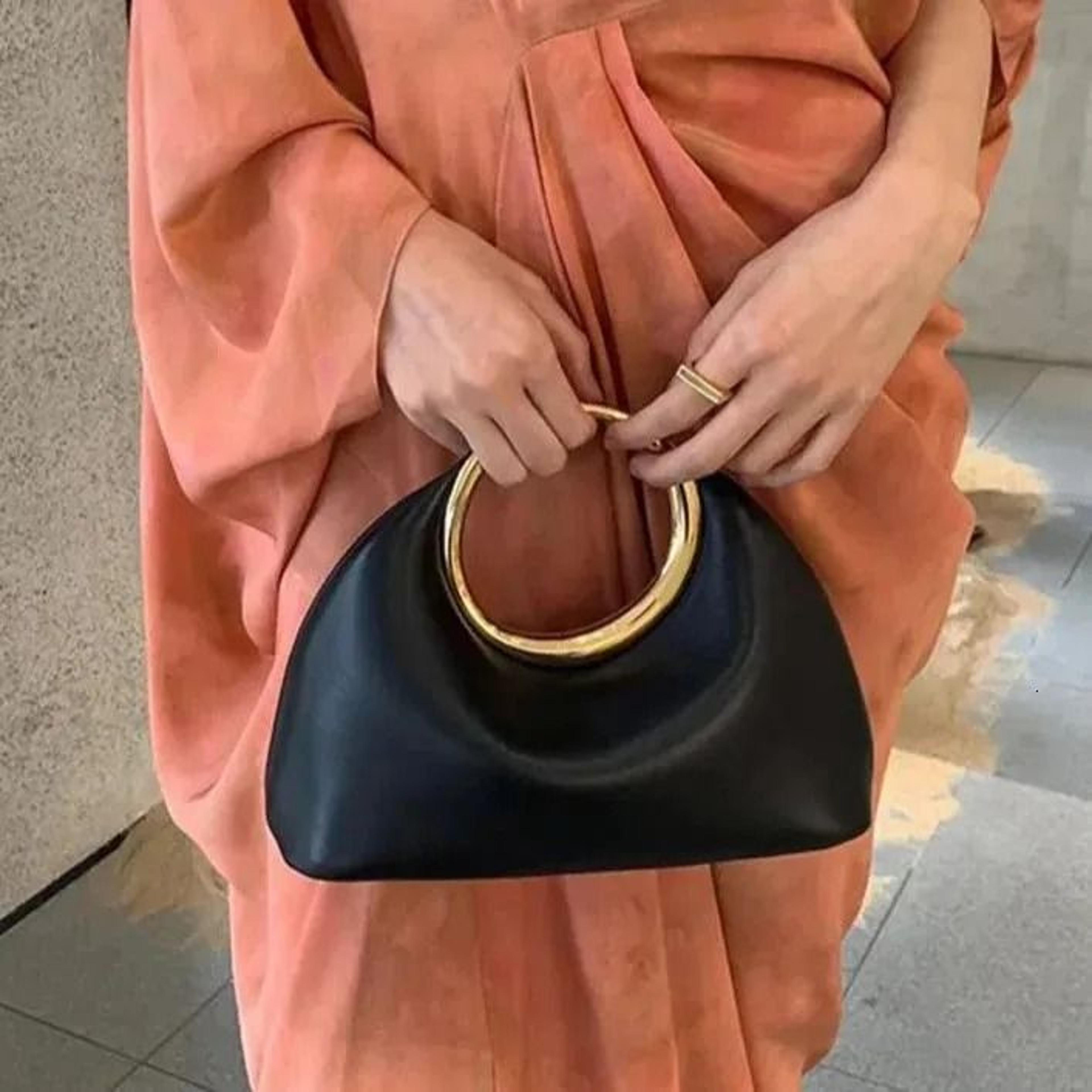 vegan leather cloud shape handbag with top handle and adjustable crossbody strap