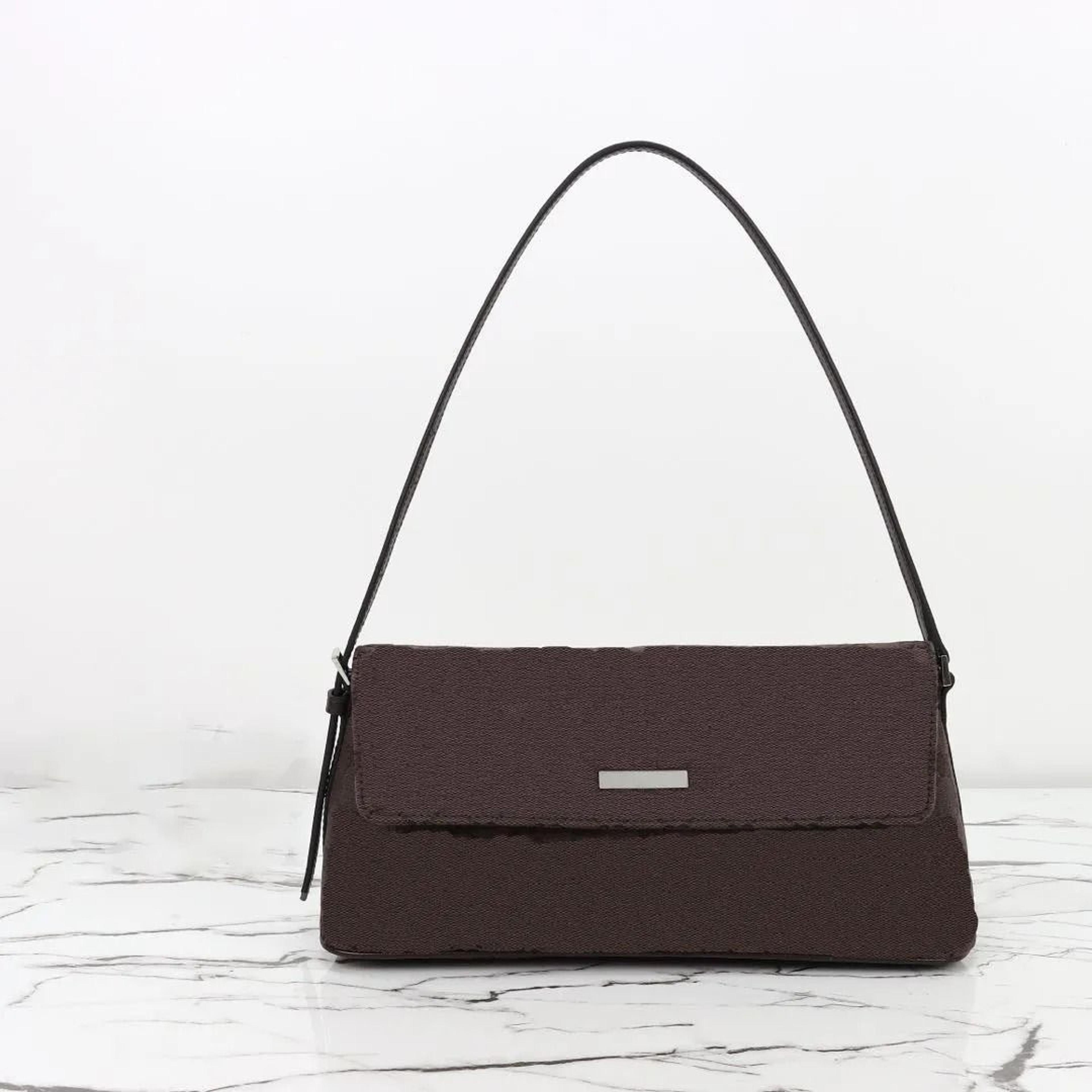 monogram canvas underarm baguette bag with classic brown flap