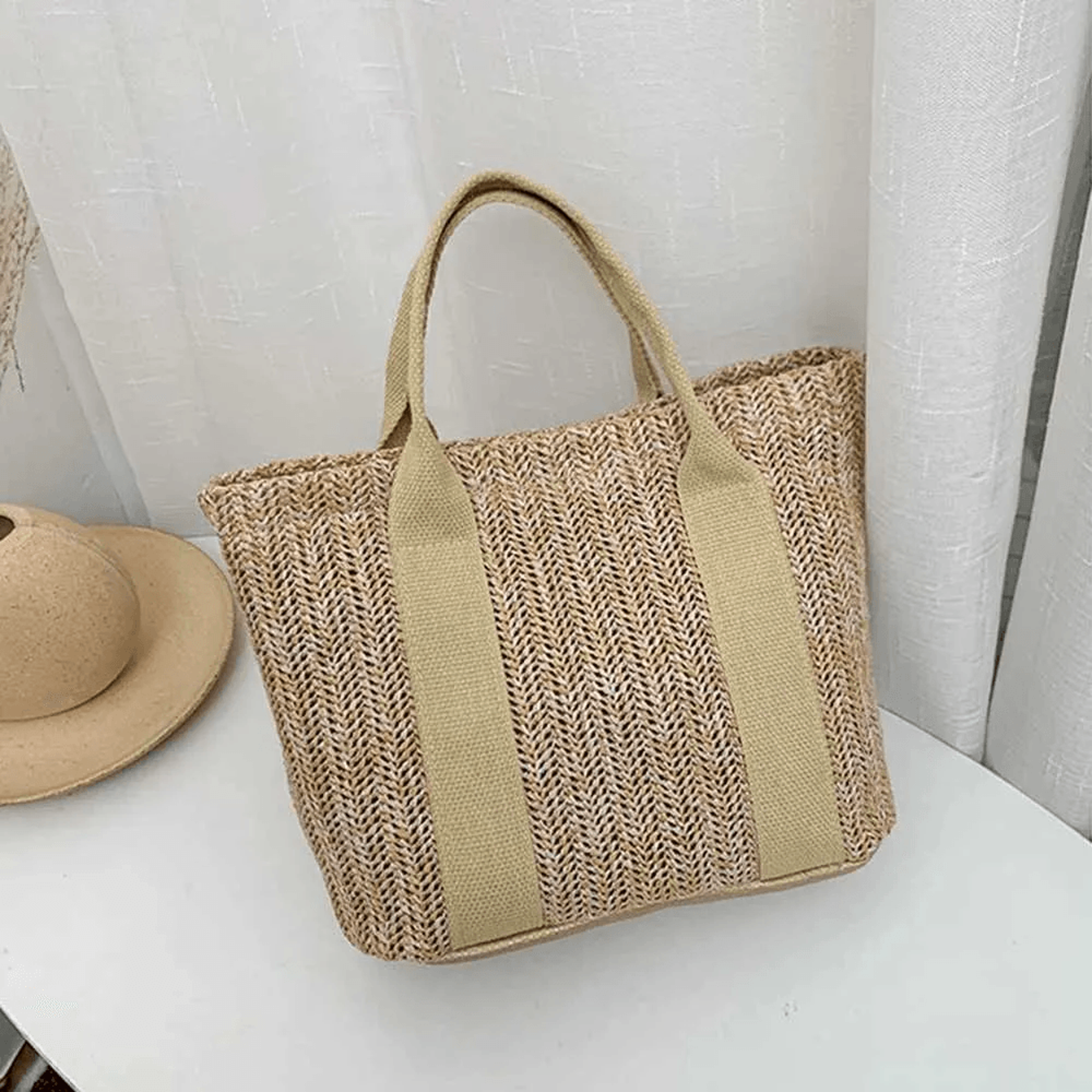 straw woven tote bag with leather handles for beach and everyday use