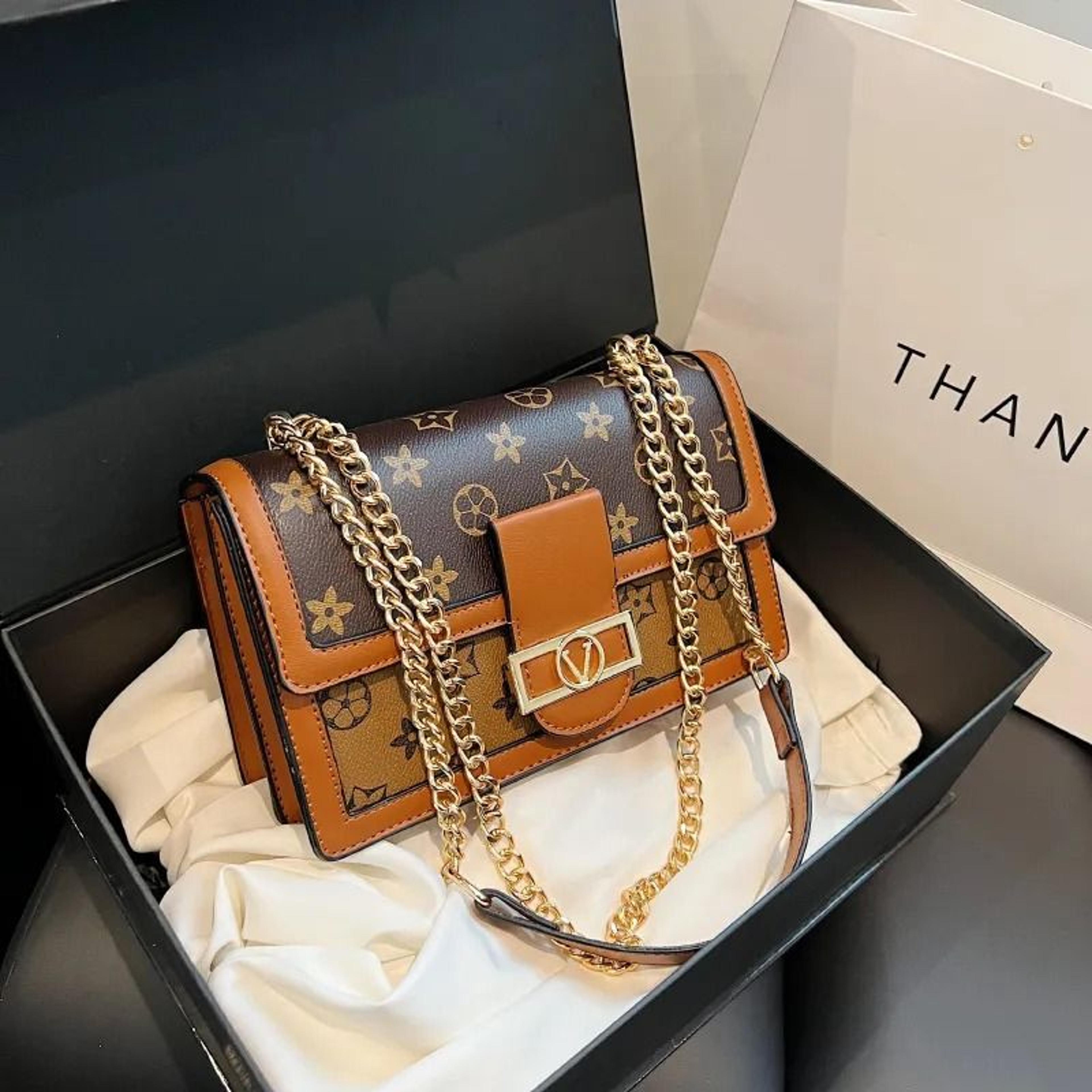 square crossbody shoulder bag with adjustable strap and chain print
