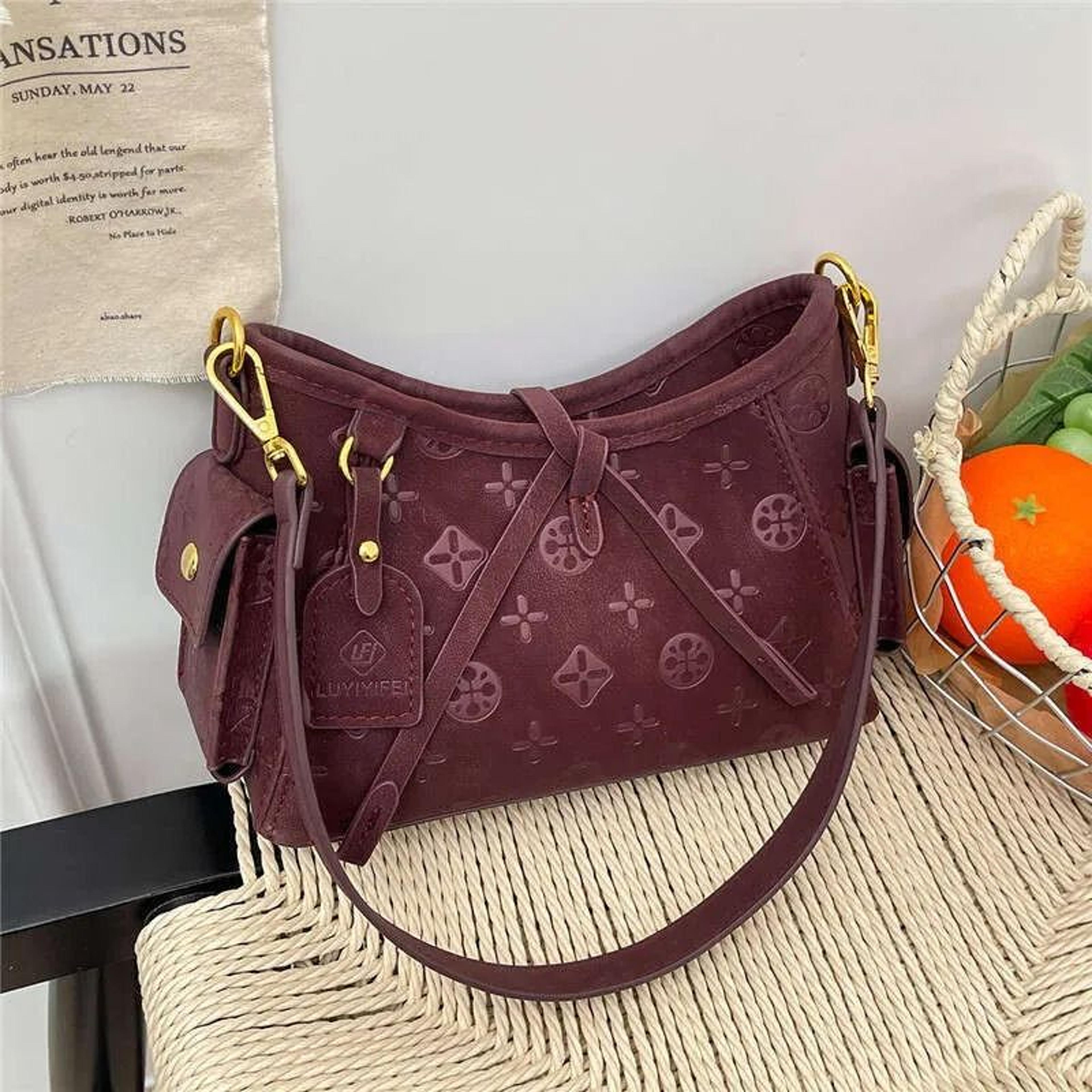 small faux leather crossbody handbag with adjustable strap and zipper closure