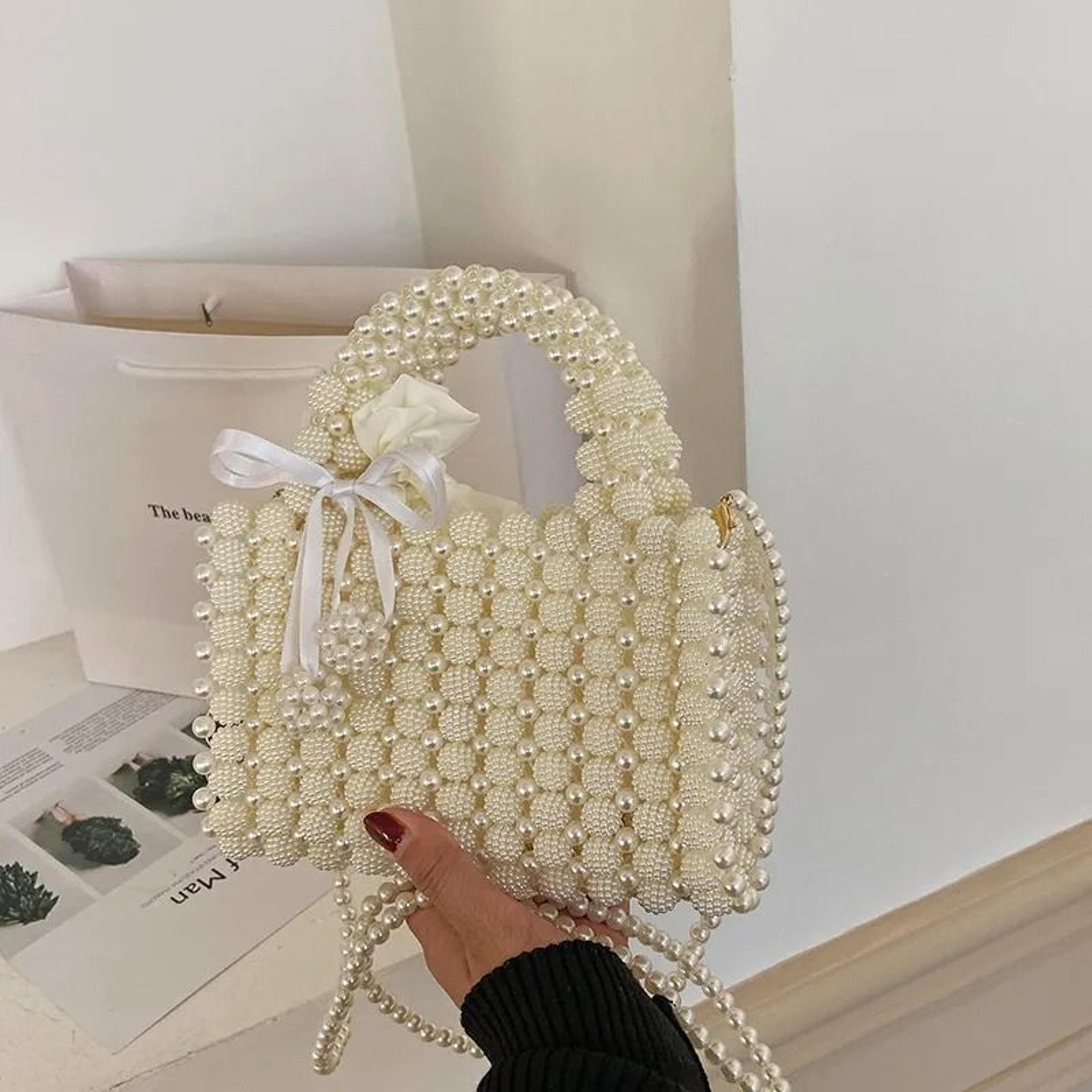 womens pearl handbag with adjustable crossbody strap and magnetic closure
