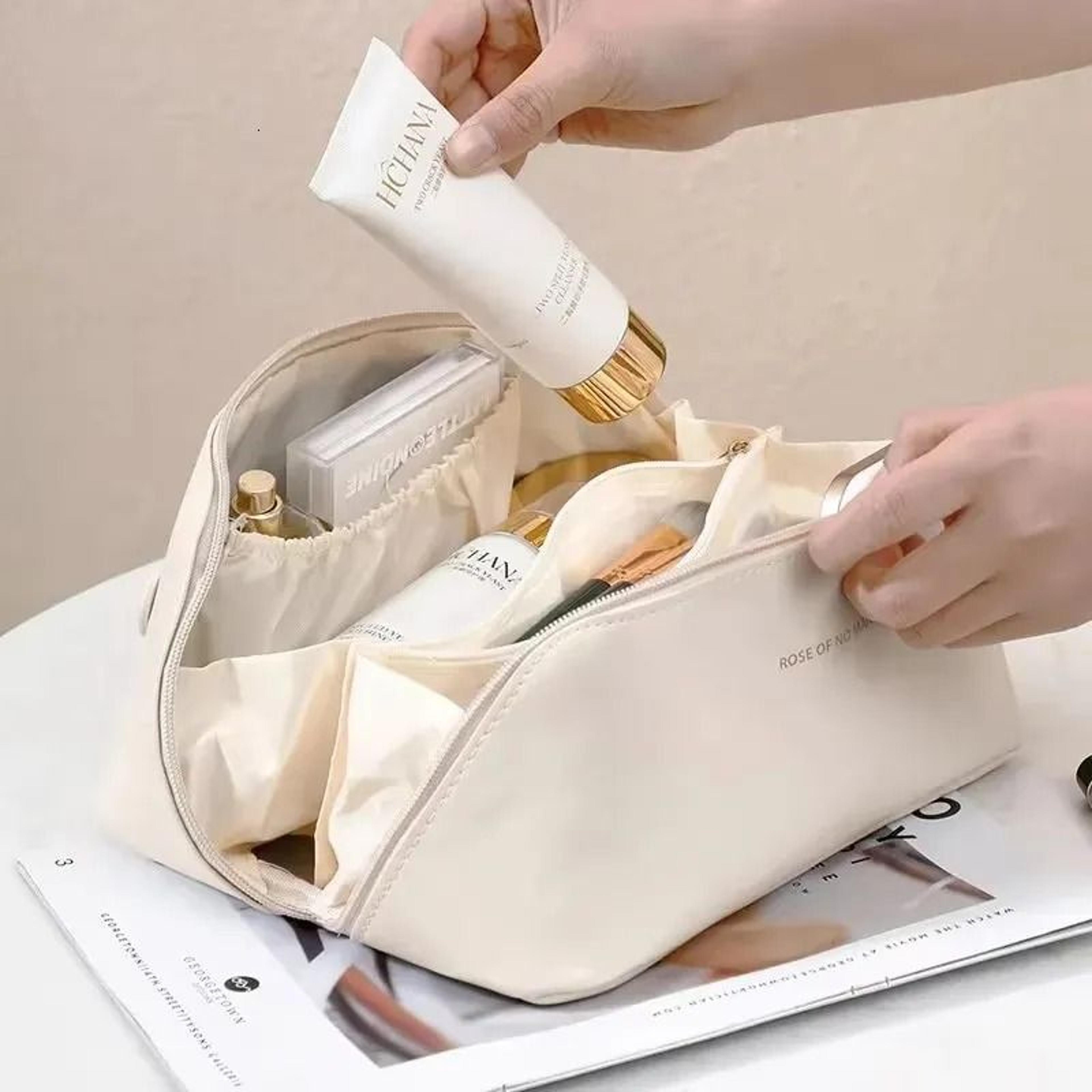 large capacity travel cosmetic bag with multiple compartments and zippered pockets