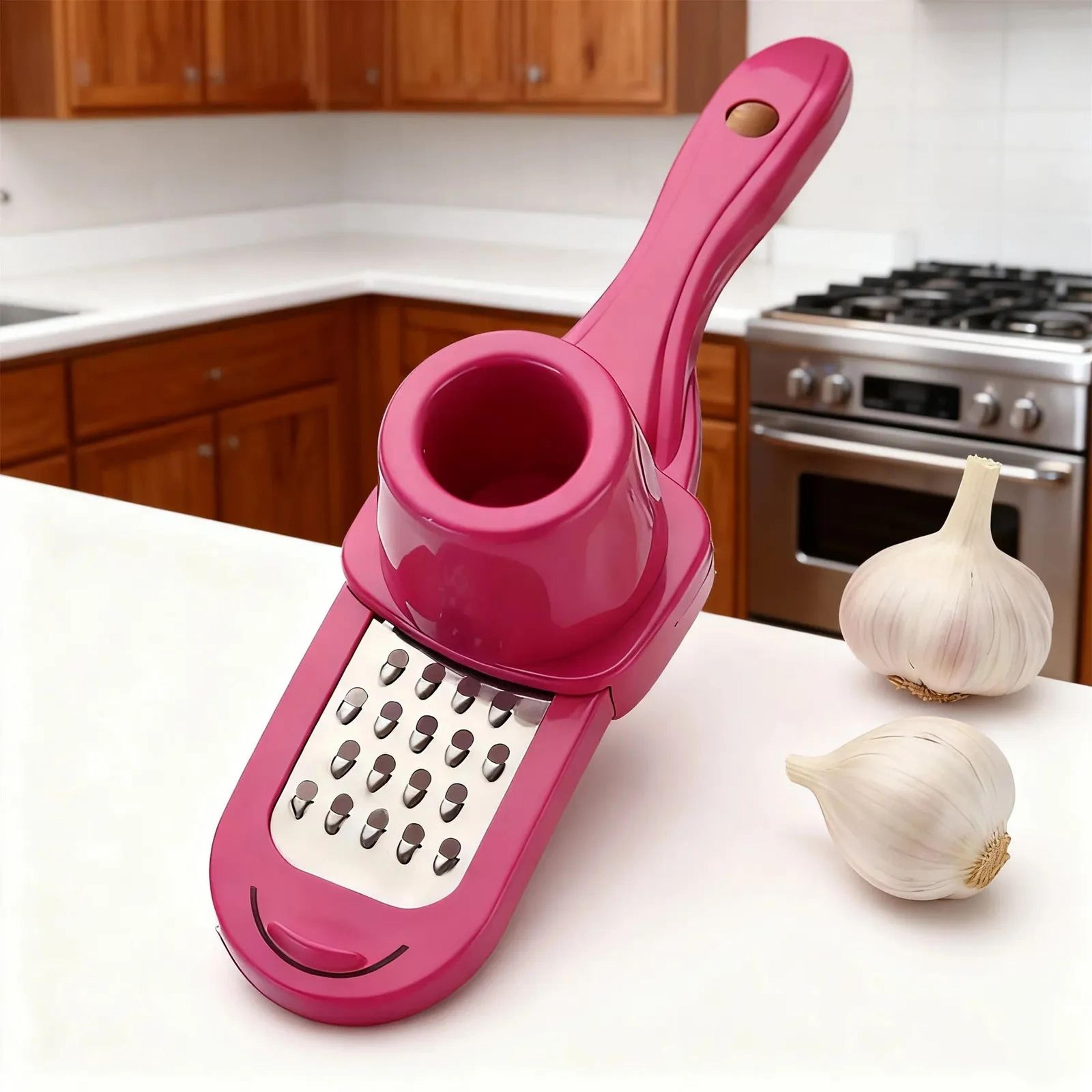 manual stainless steel garlic crusher with ergonomic pink handle