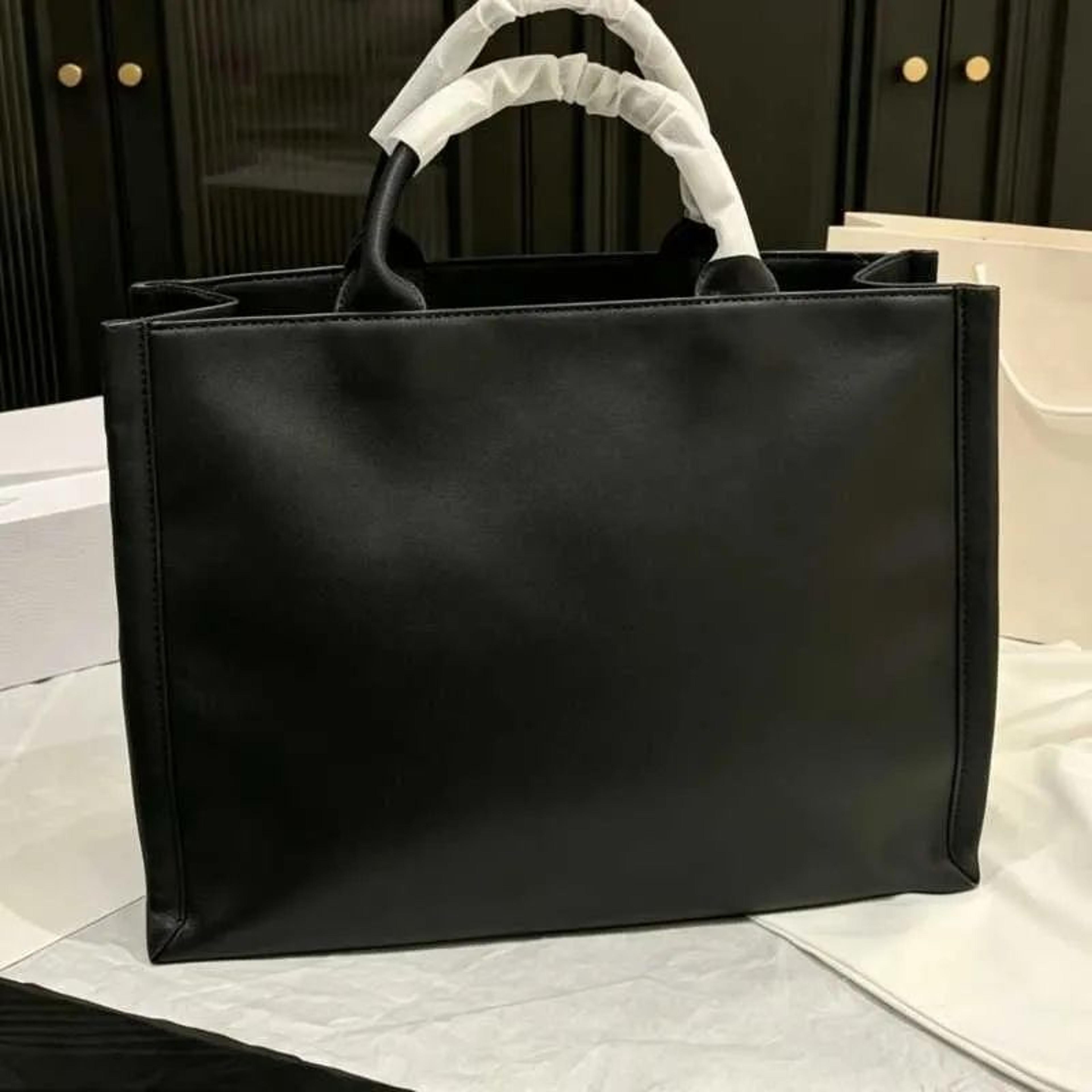 large dark denim book tote bag with gold embroidery for everyday carry