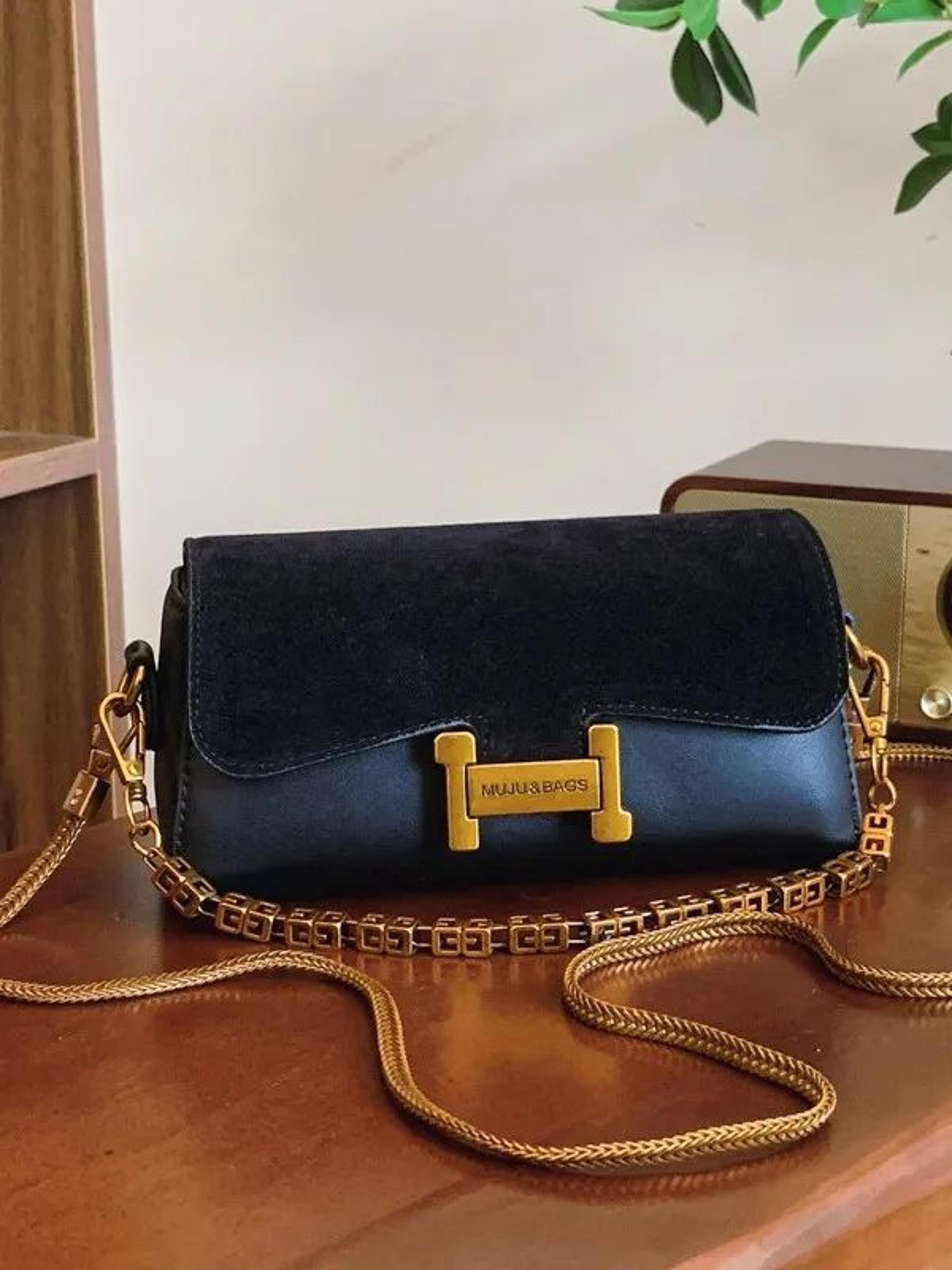 women adjustable shoulder purse with chain detail and crossbody strap