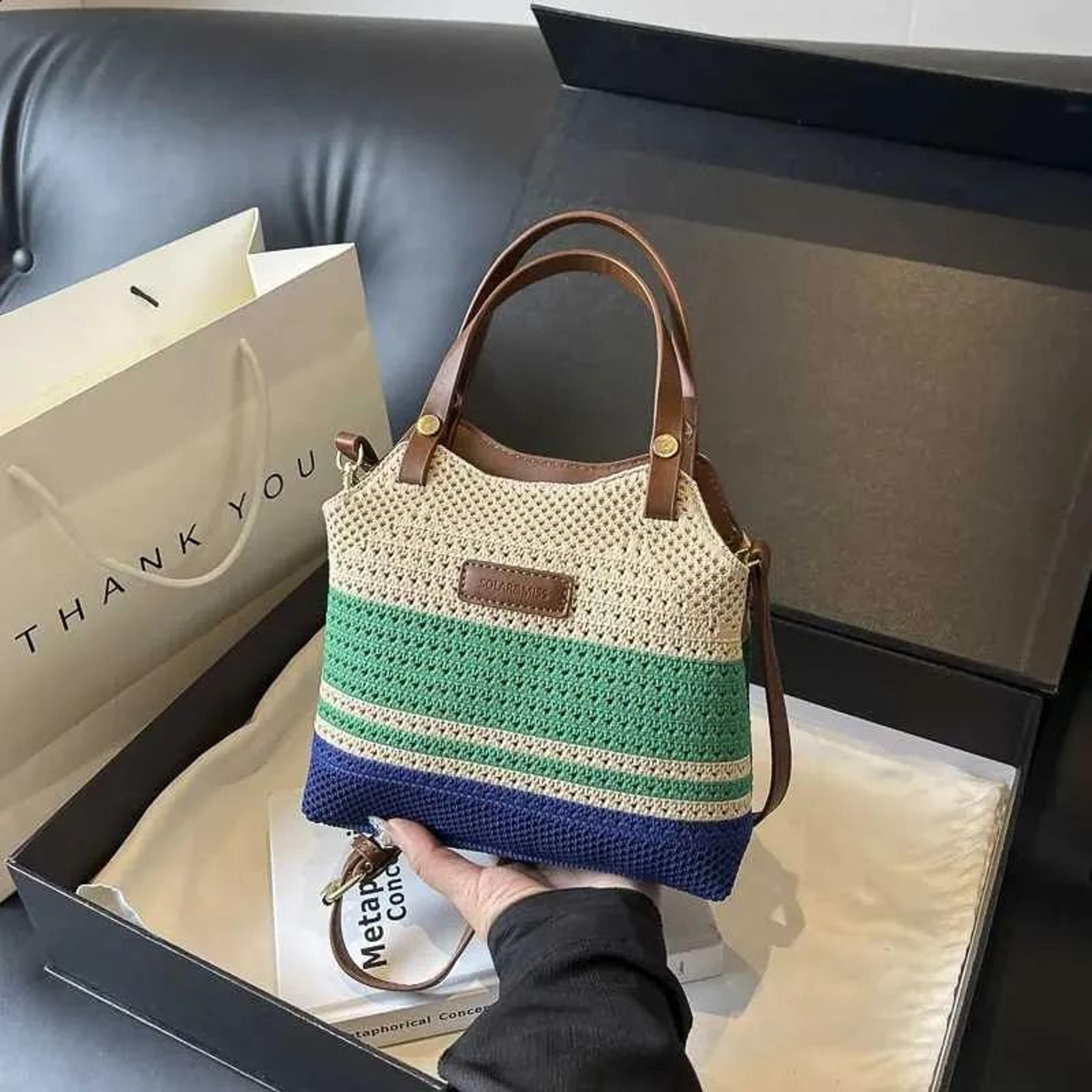 women woven shoulder bag with contrasting colors and diagonal strap