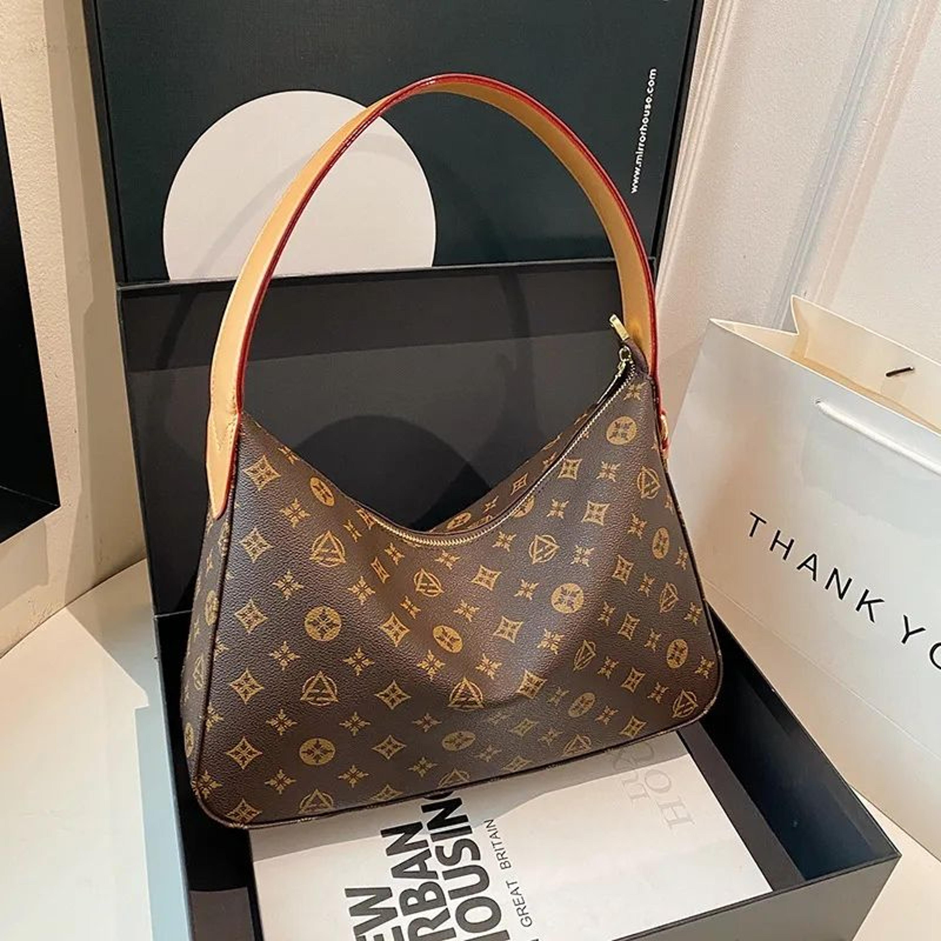 large monogram canvas hobo shoulder bag with leather strap and tassel