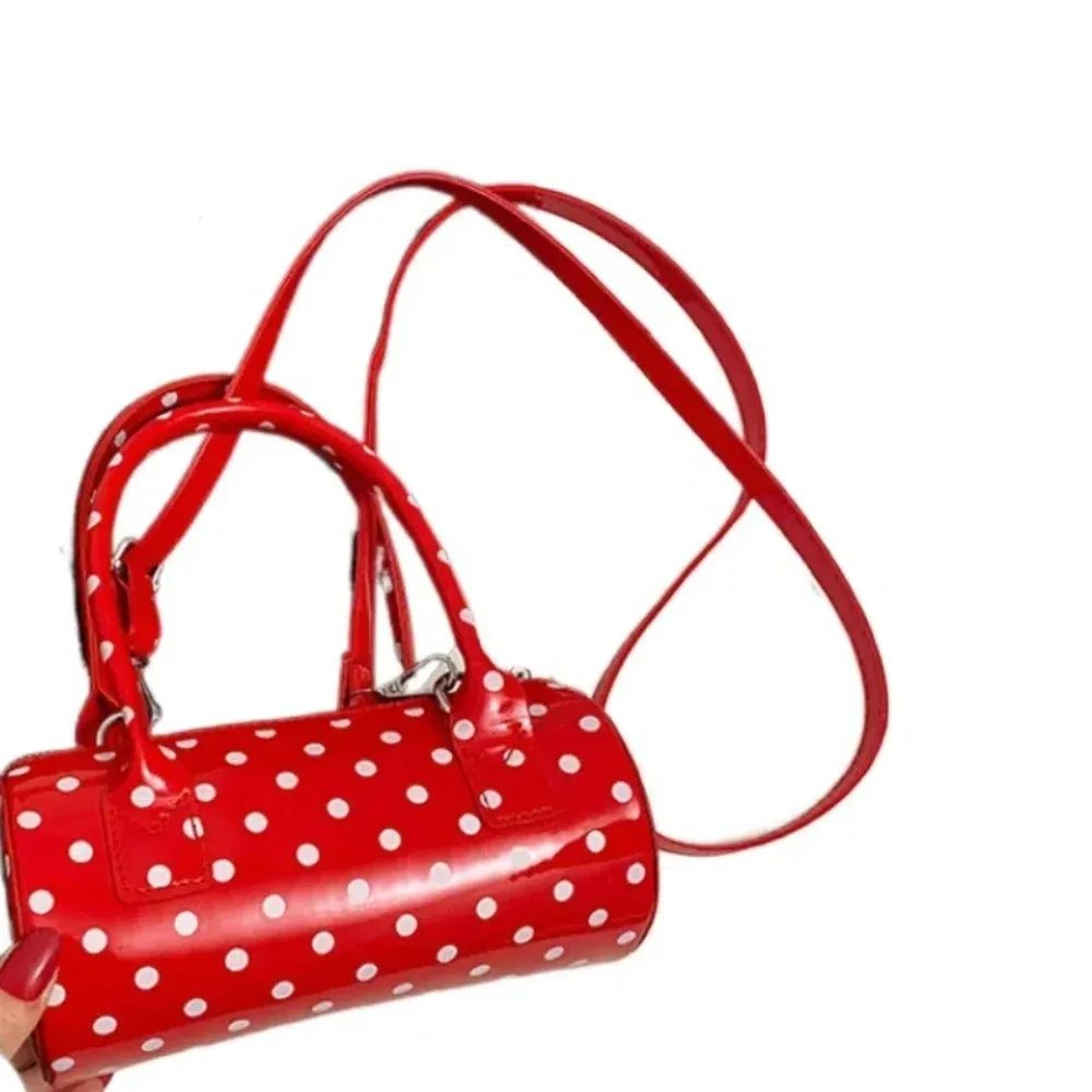 women mini cylindrical crossbody bag with polka dots and adjustable strap