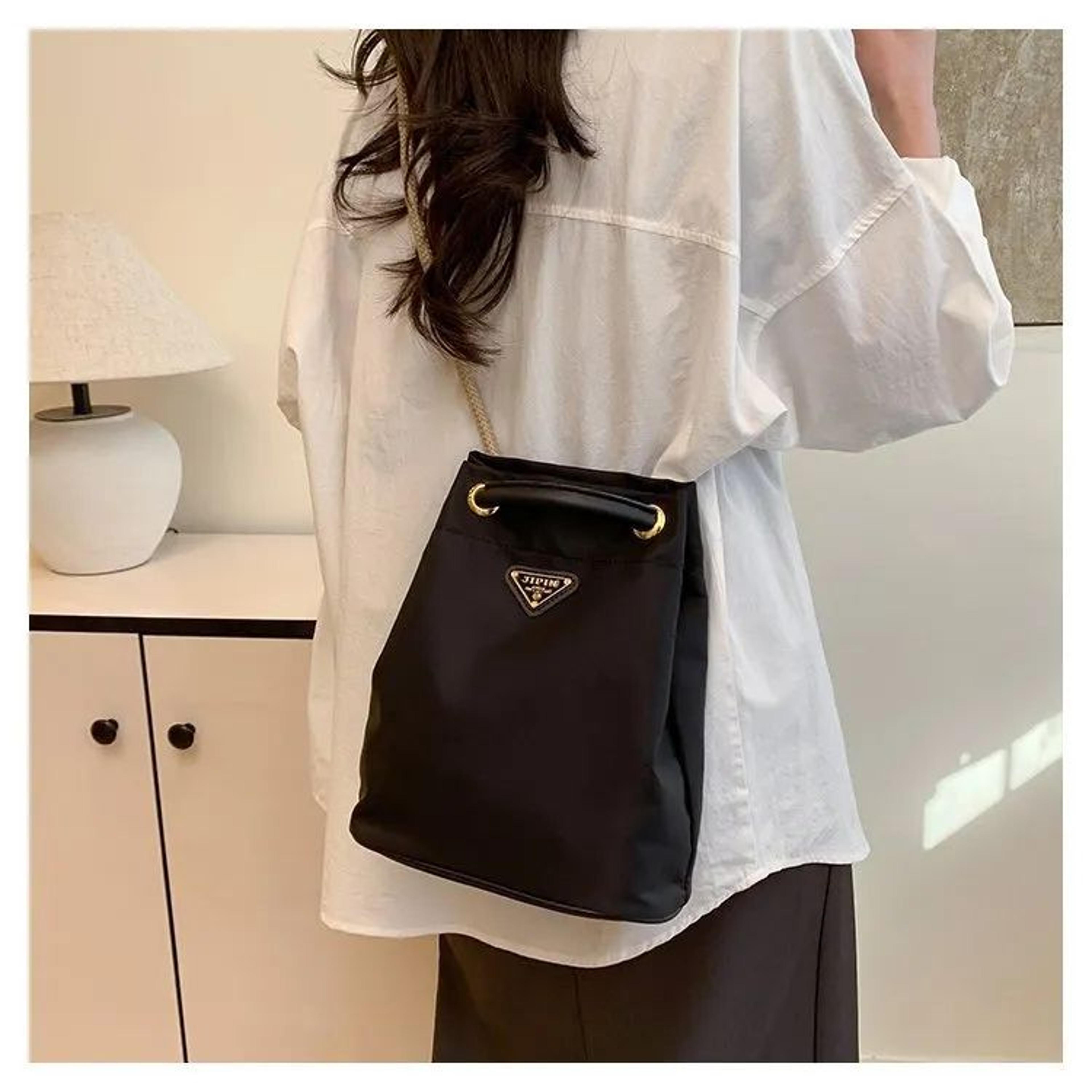 lightweight nylon bucket shoulder bag with casual crossbody design
