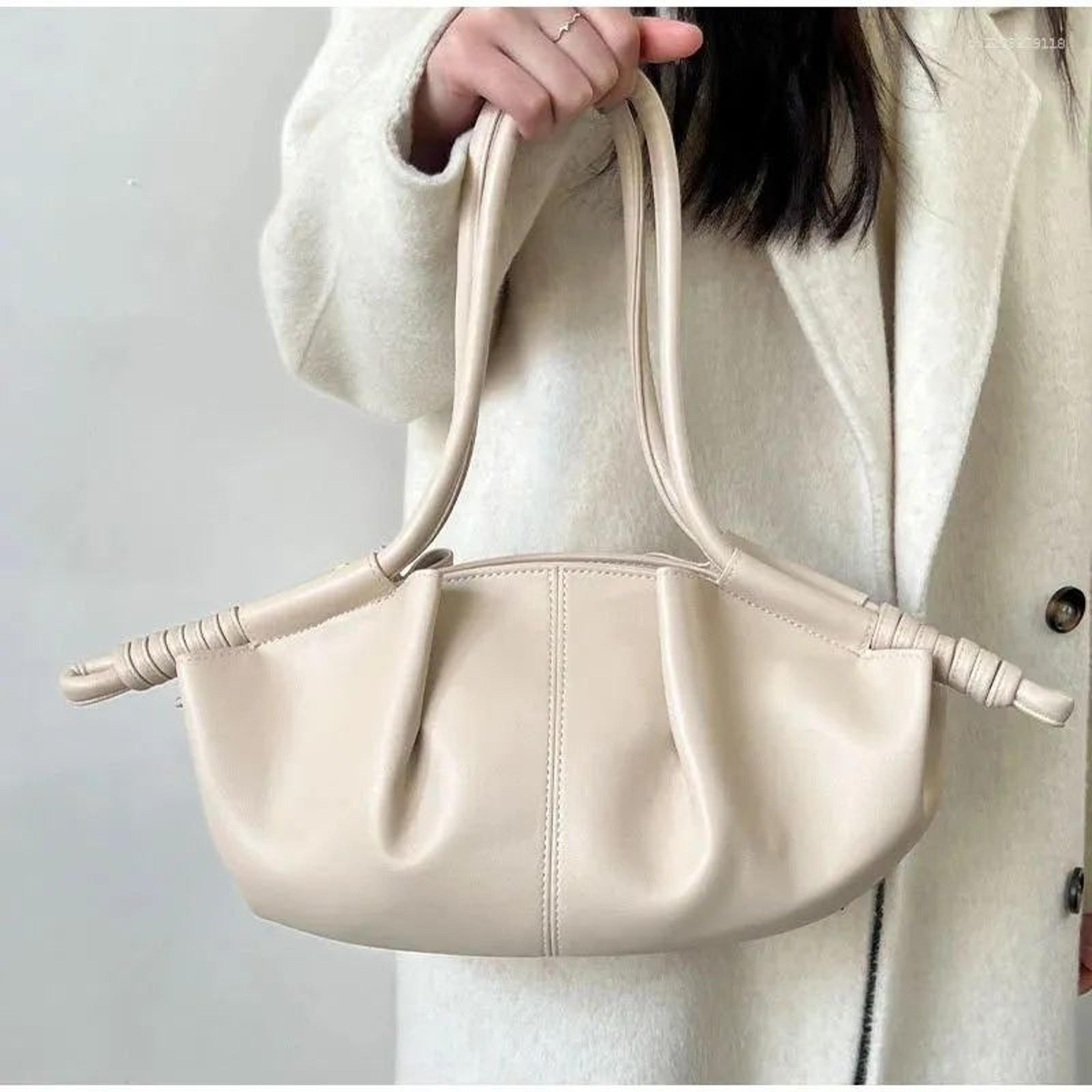 womens cloud dumpling tote bag with pleated design and adjustable strap