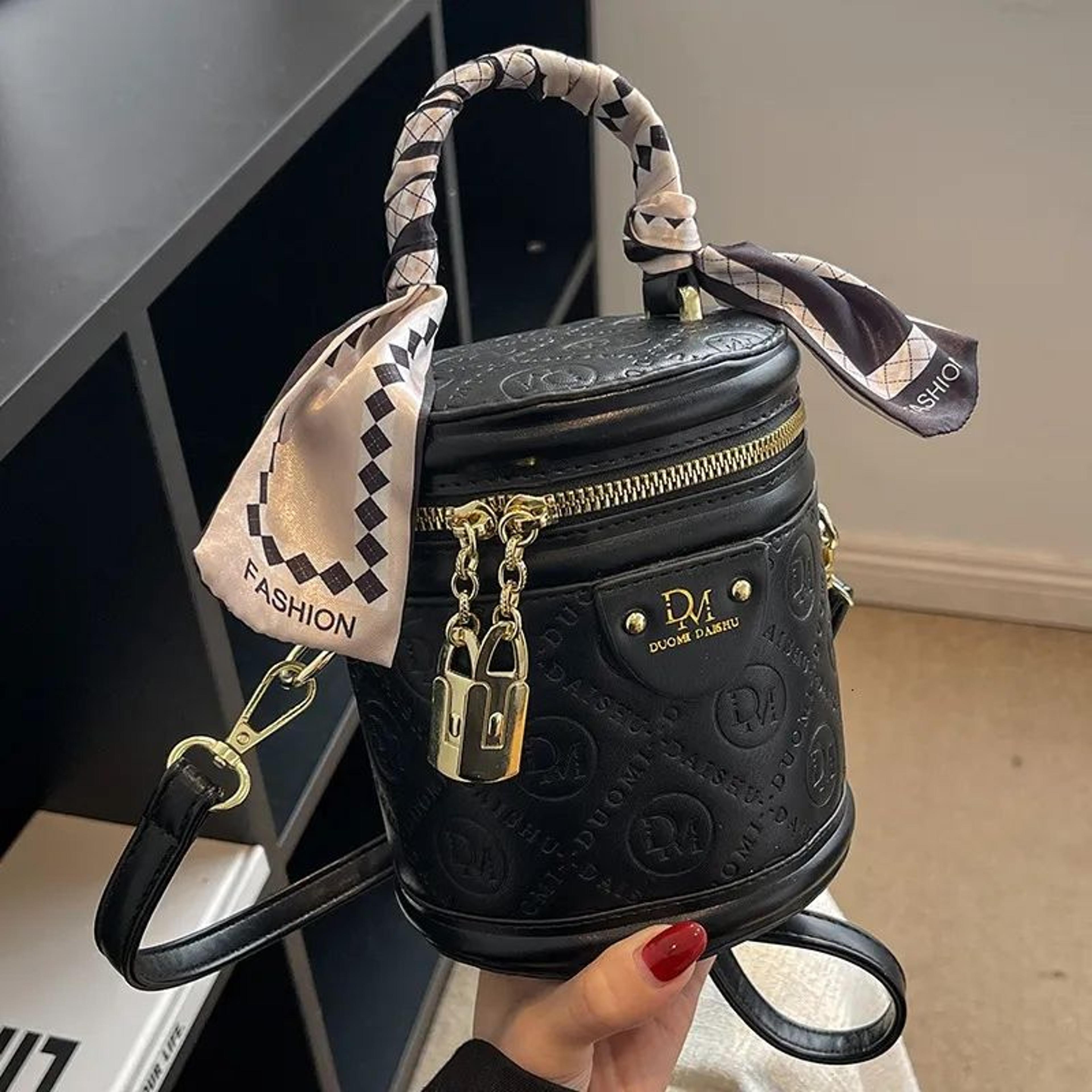 womens small bucket crossbody bag with handheld design
