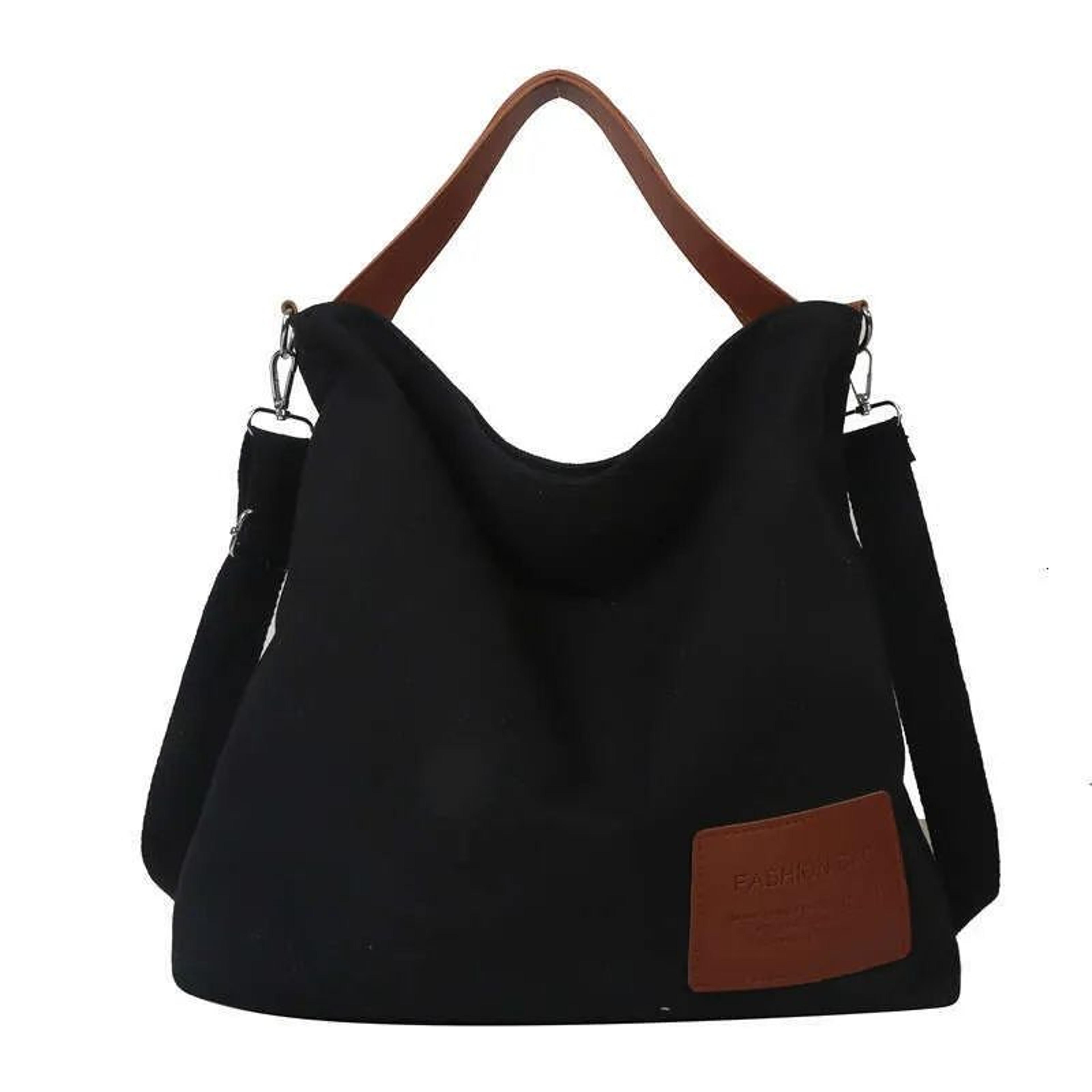 large patent leather half-moon crossbody tote bag with chain accent