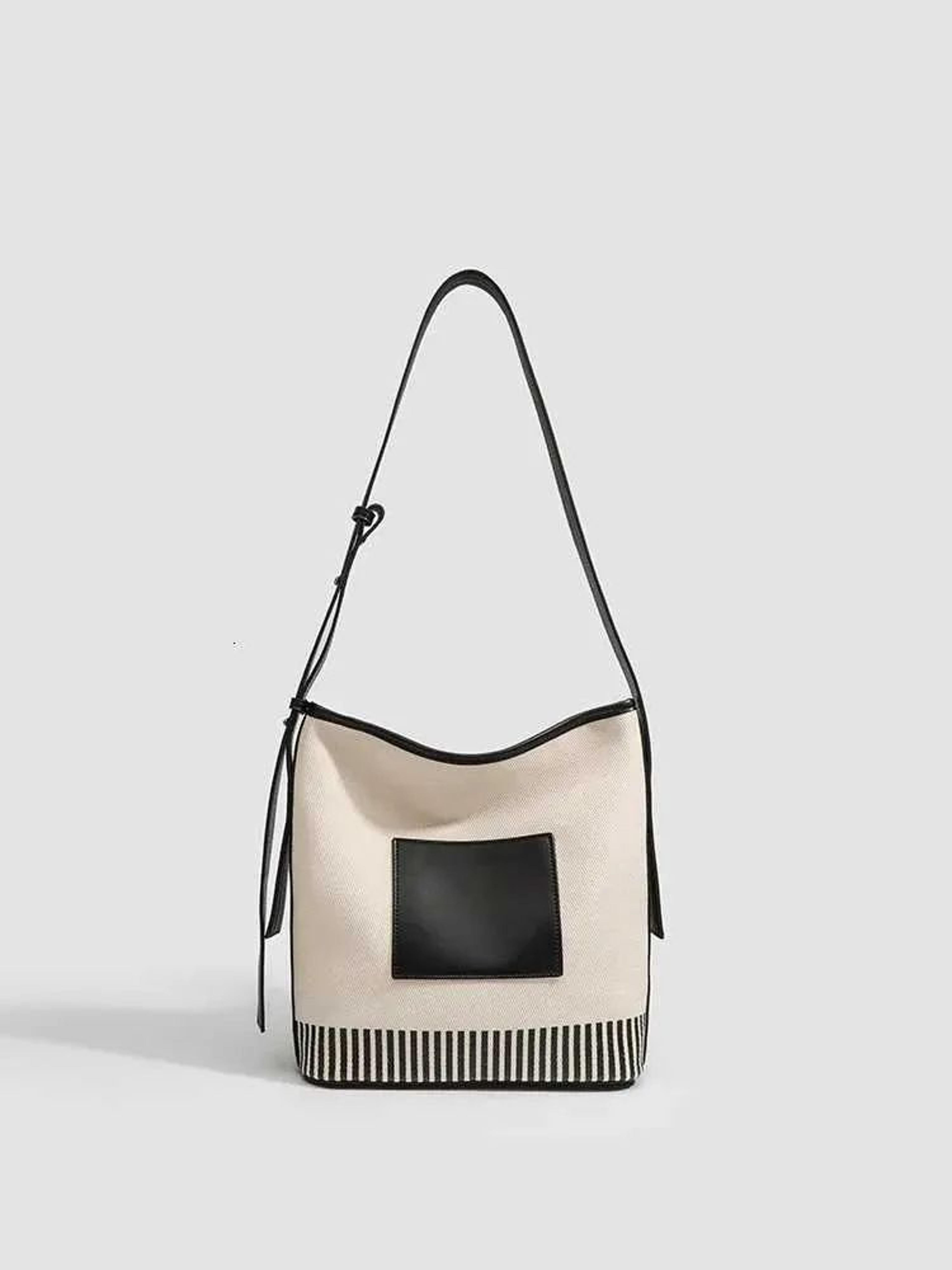womens large capacity canvas shoulder bag with vegan leather bucket design