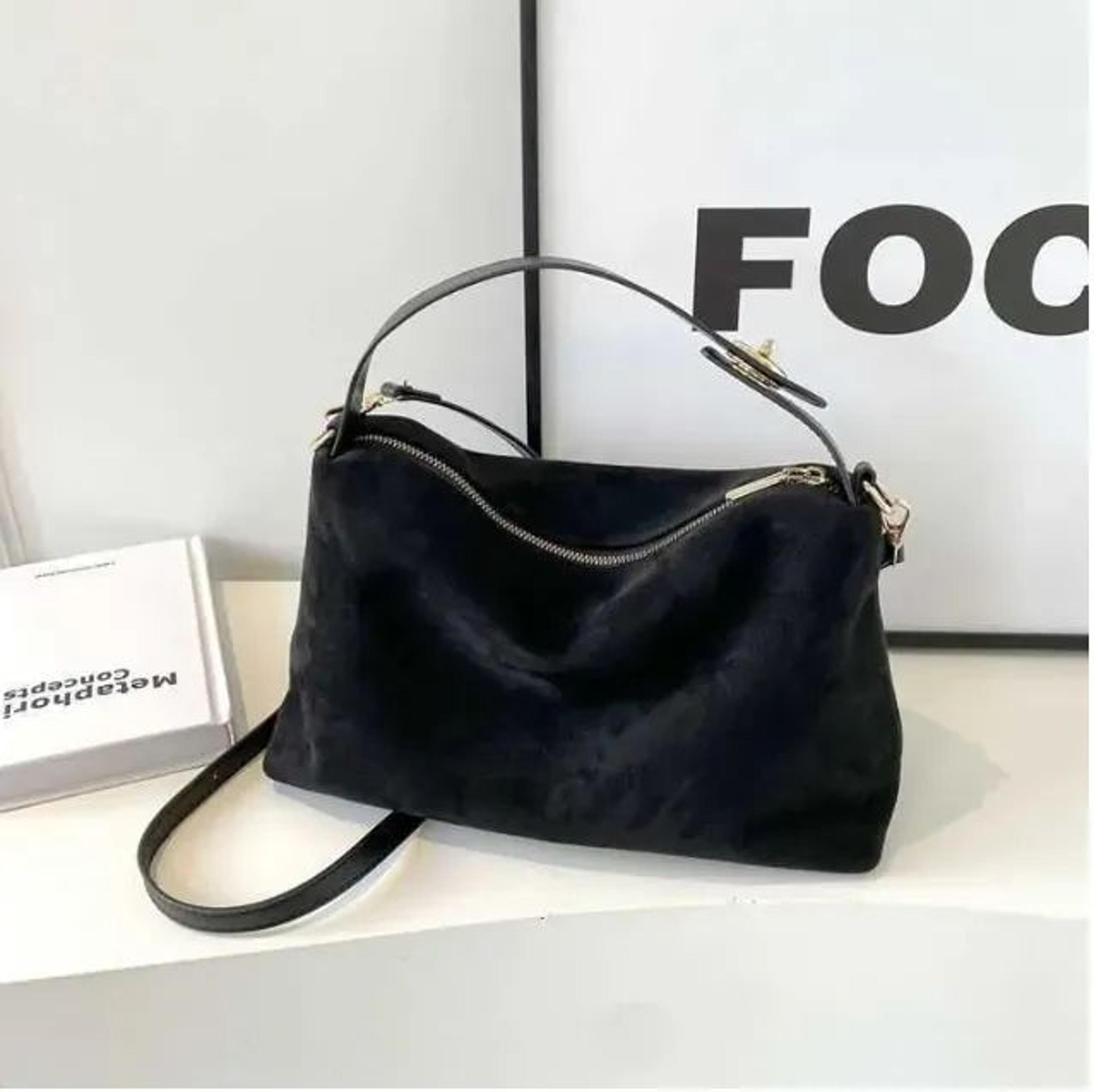 mini faux suede shoulder bag for women with boomerang shape and metal accents