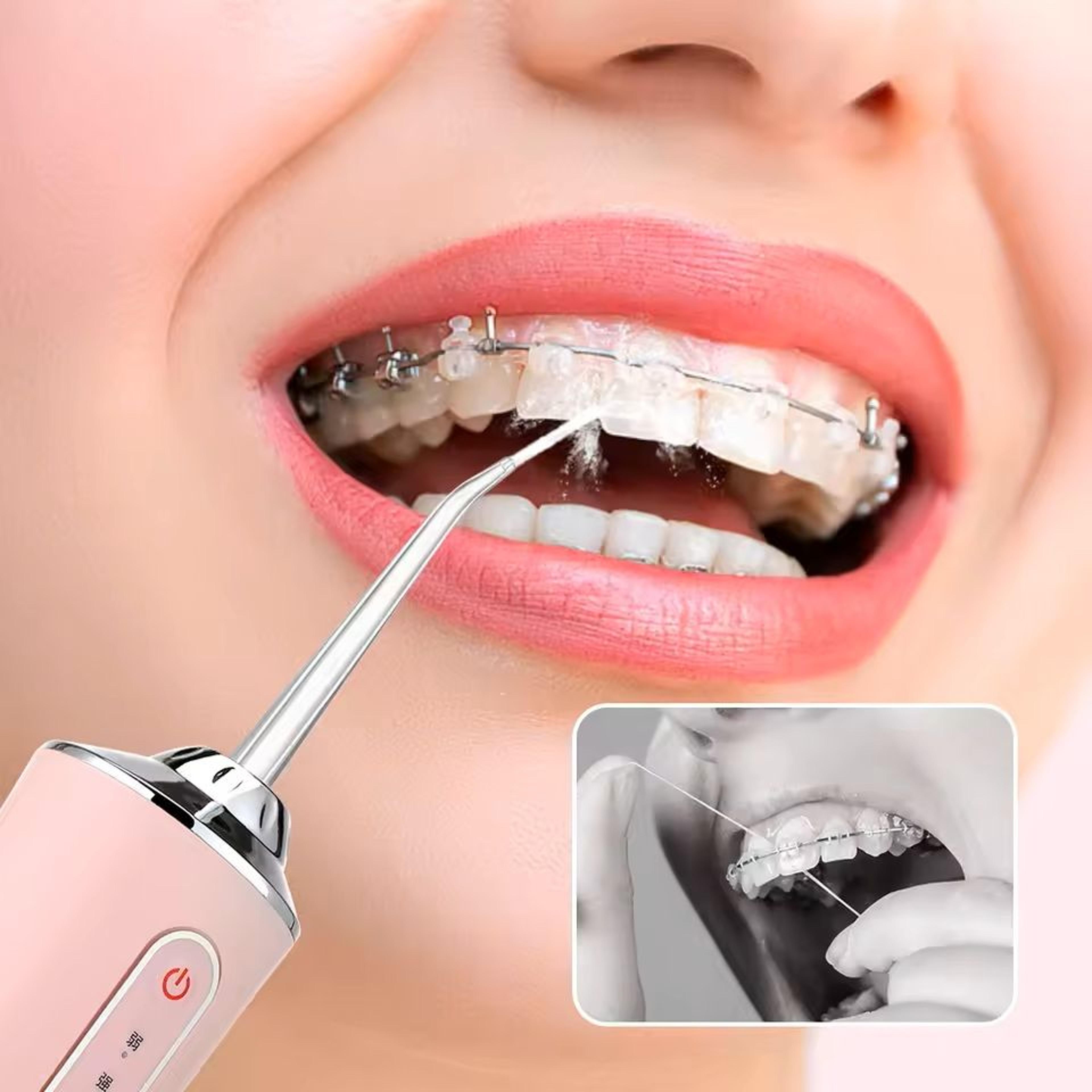portable rechargeable dental water flosser with 4 jet tips