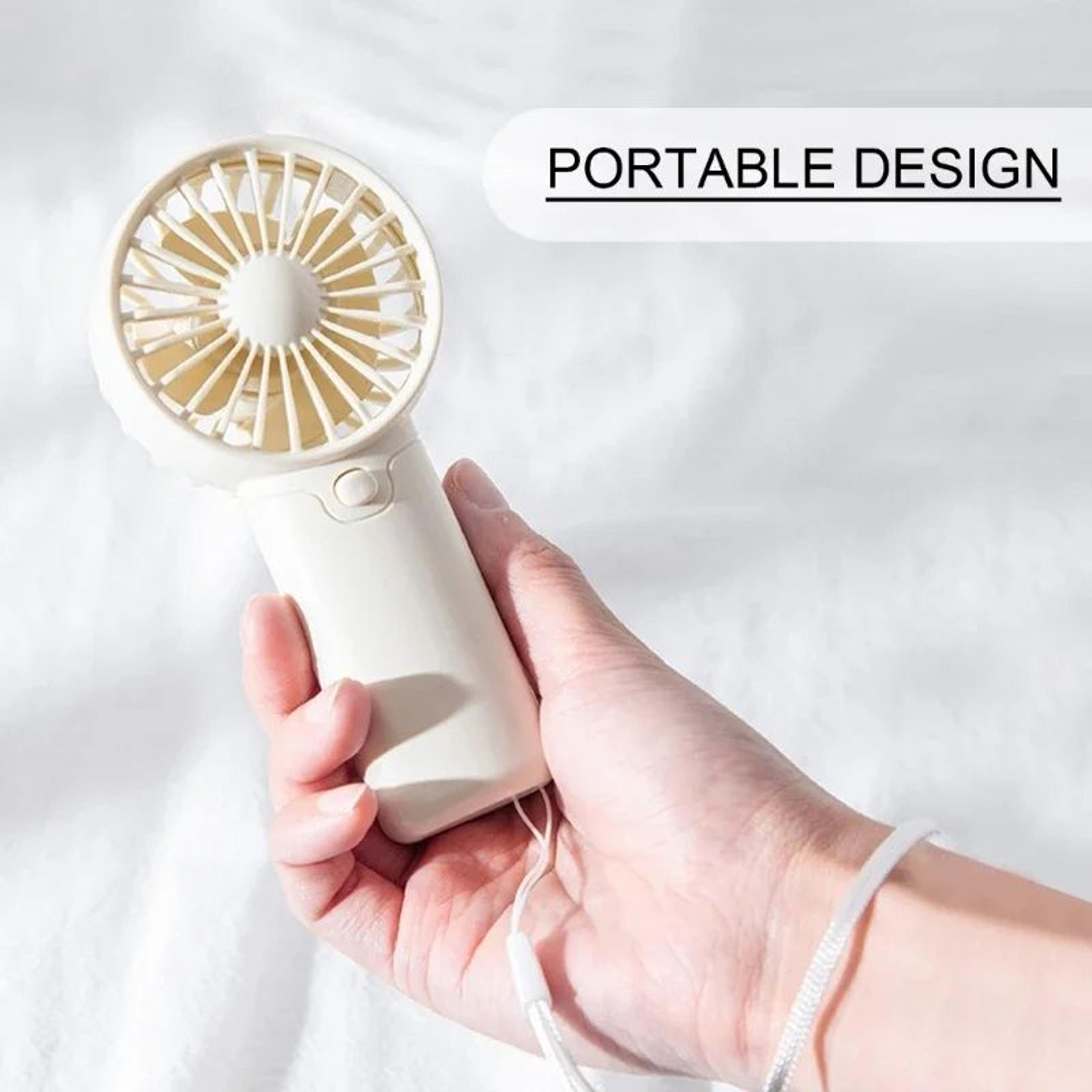 portable mini fan for travel, lightweight handheld fan with aaa battery power, pocket-size cooling