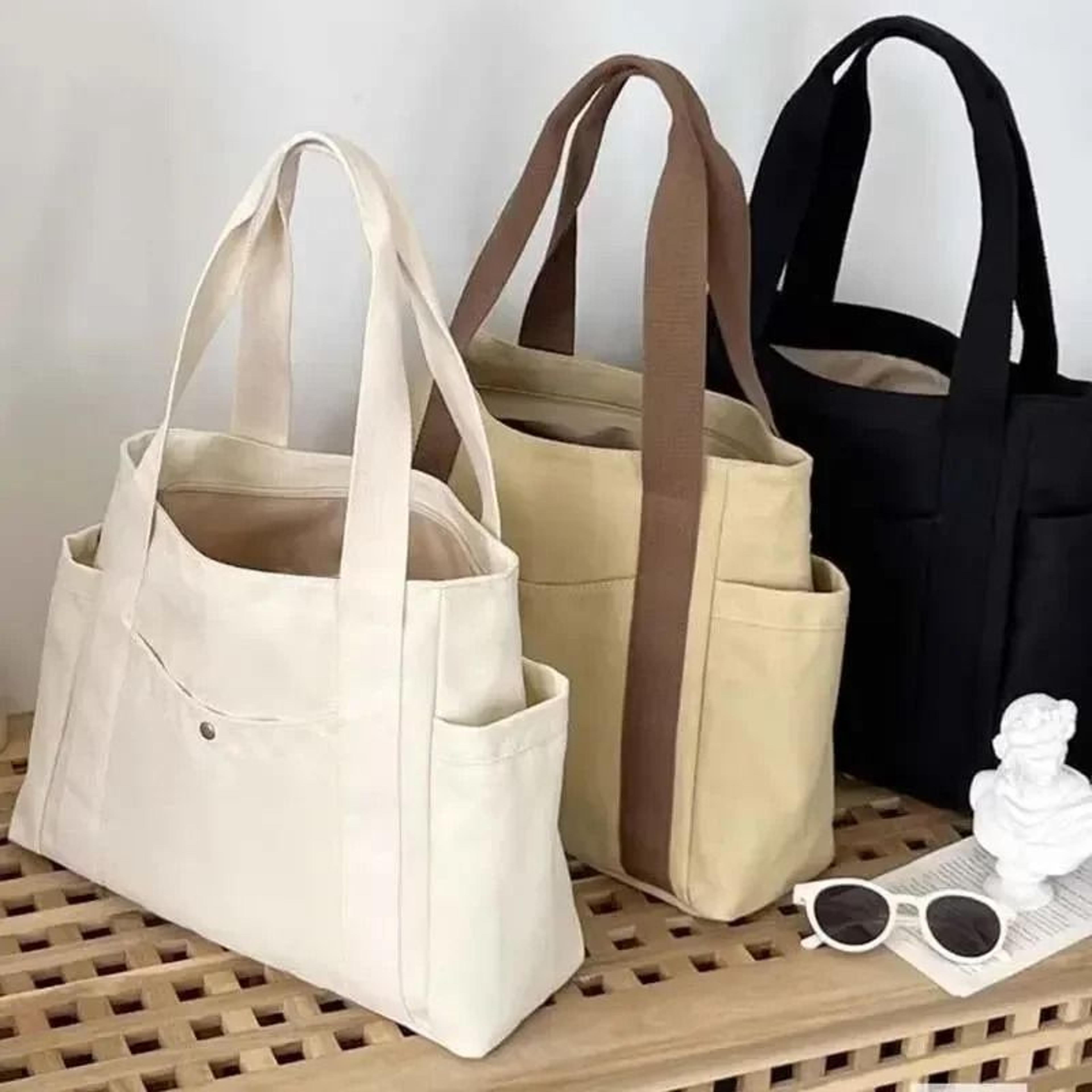 versatile large capacity canvas shoulder tote bag for work and students