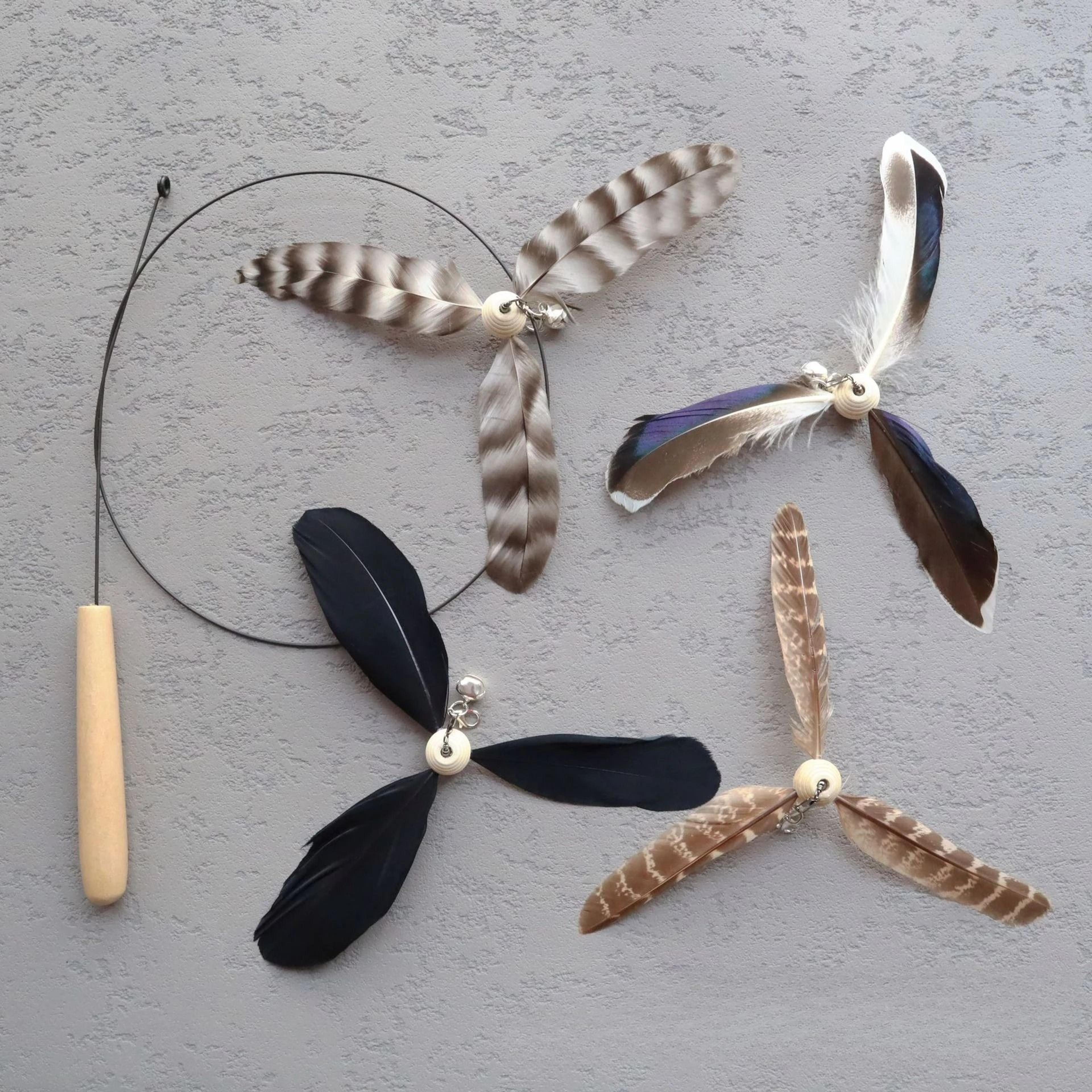 rotating feather cat teaser stick for interactive chasing and indoor play