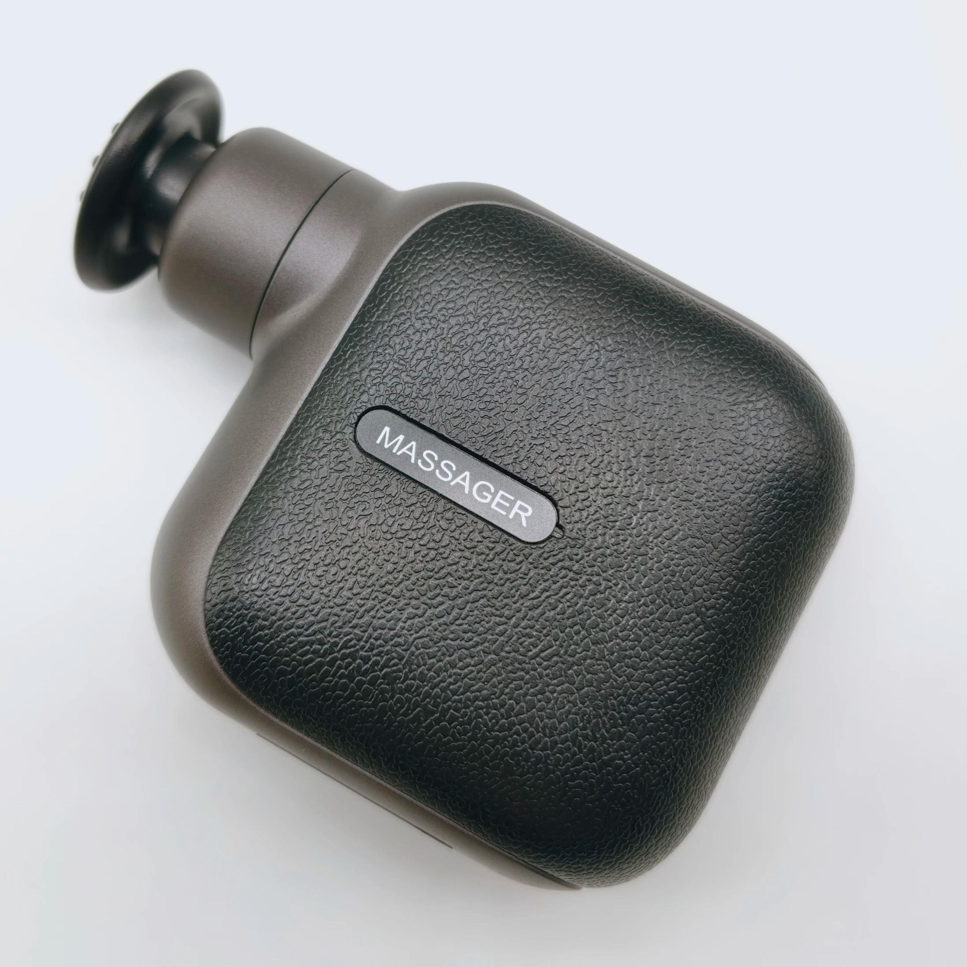 portable mini massage gun with four silicone heads