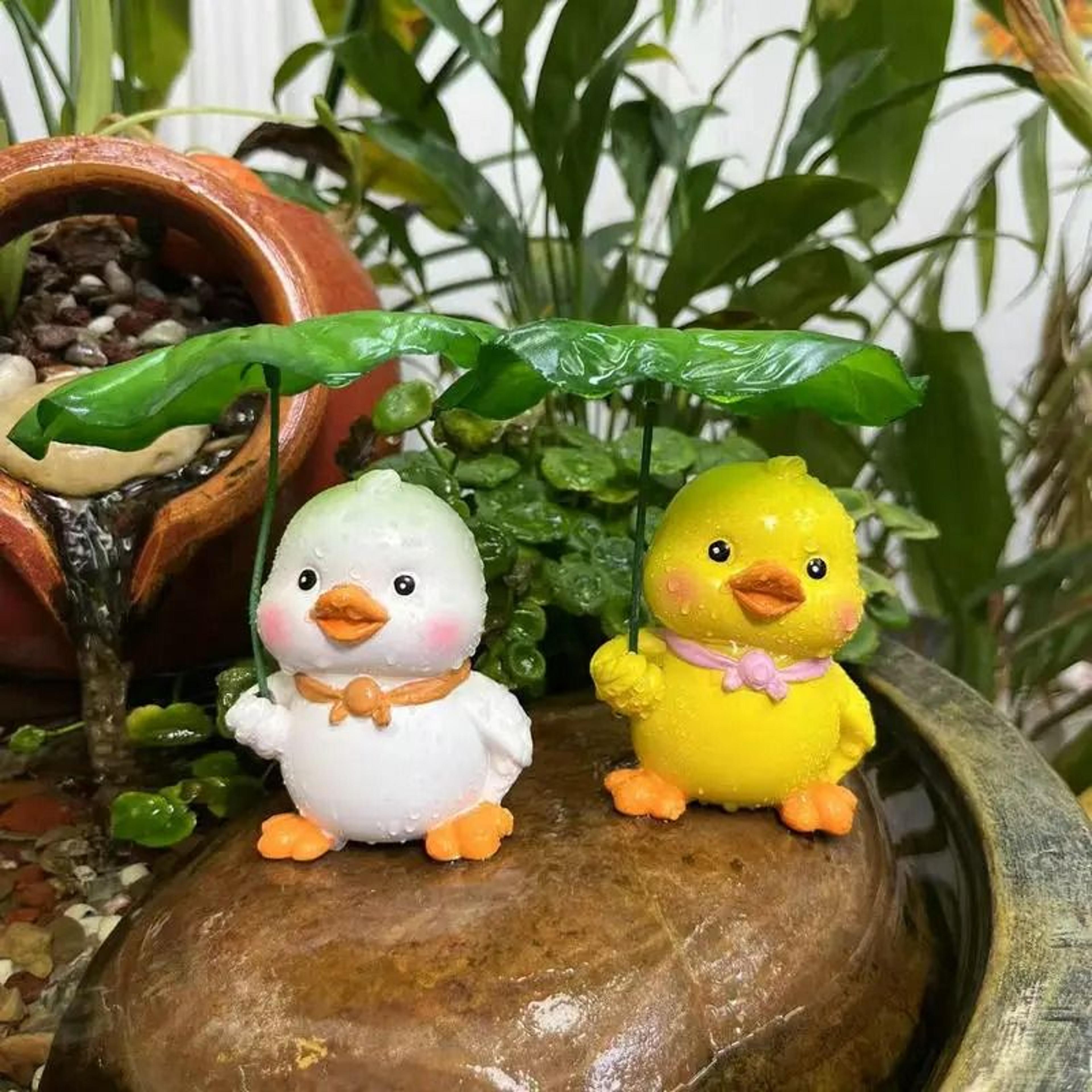 charming duck garden statue with leaf umbrella