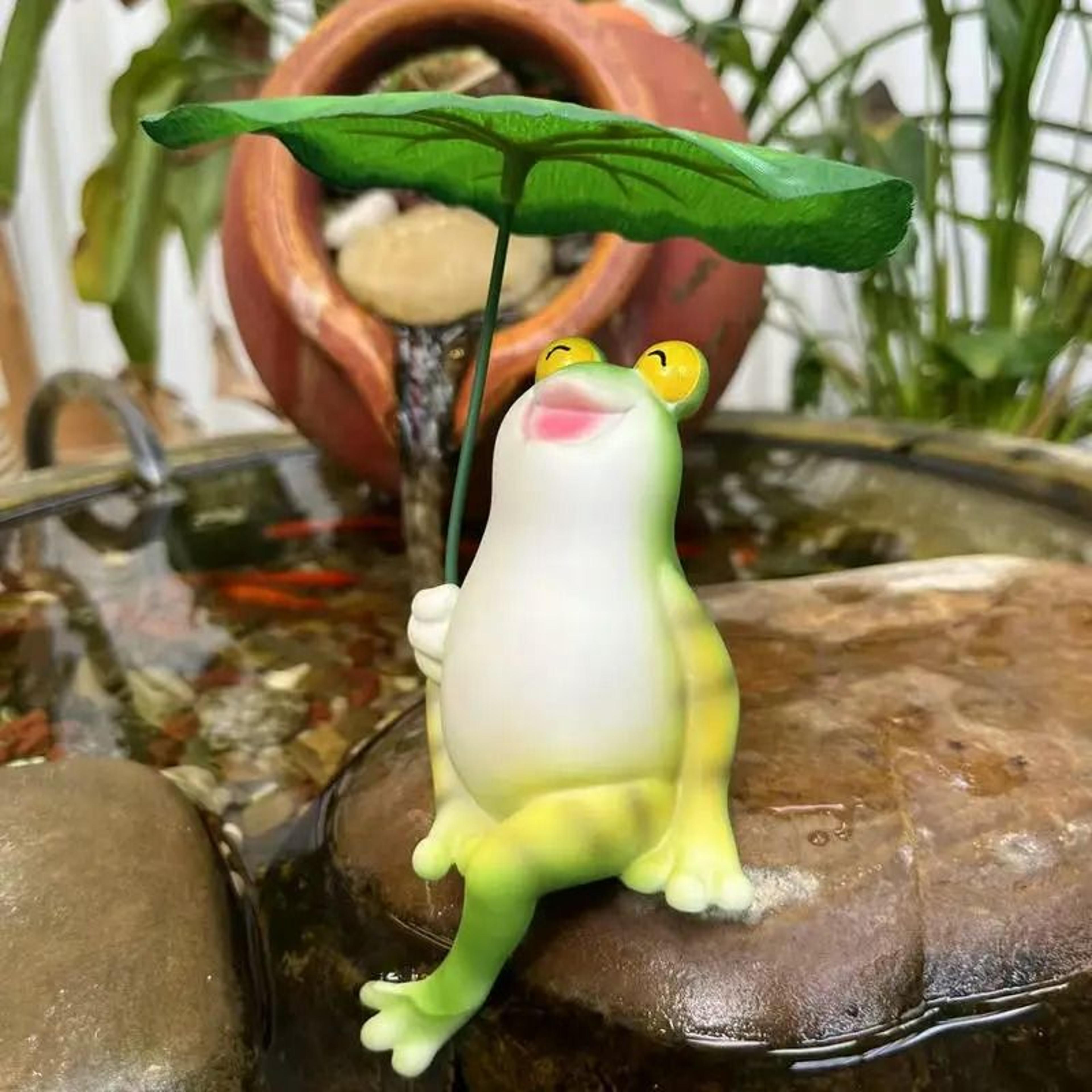 smiling resin frog garden statue with leaf umbrella for whimsical outdoor decor