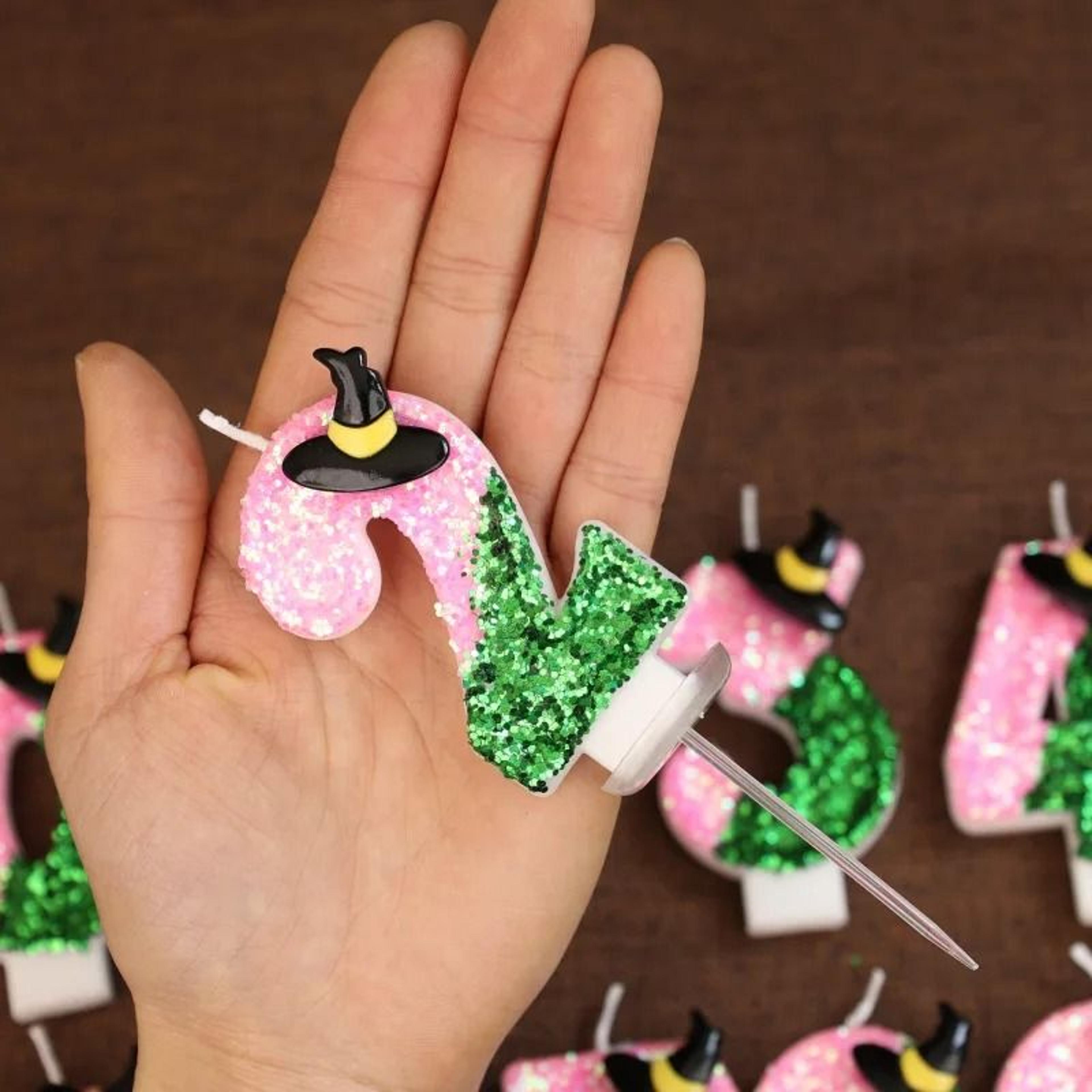 pink green witch number birthday candle for magical themed cake celebrations