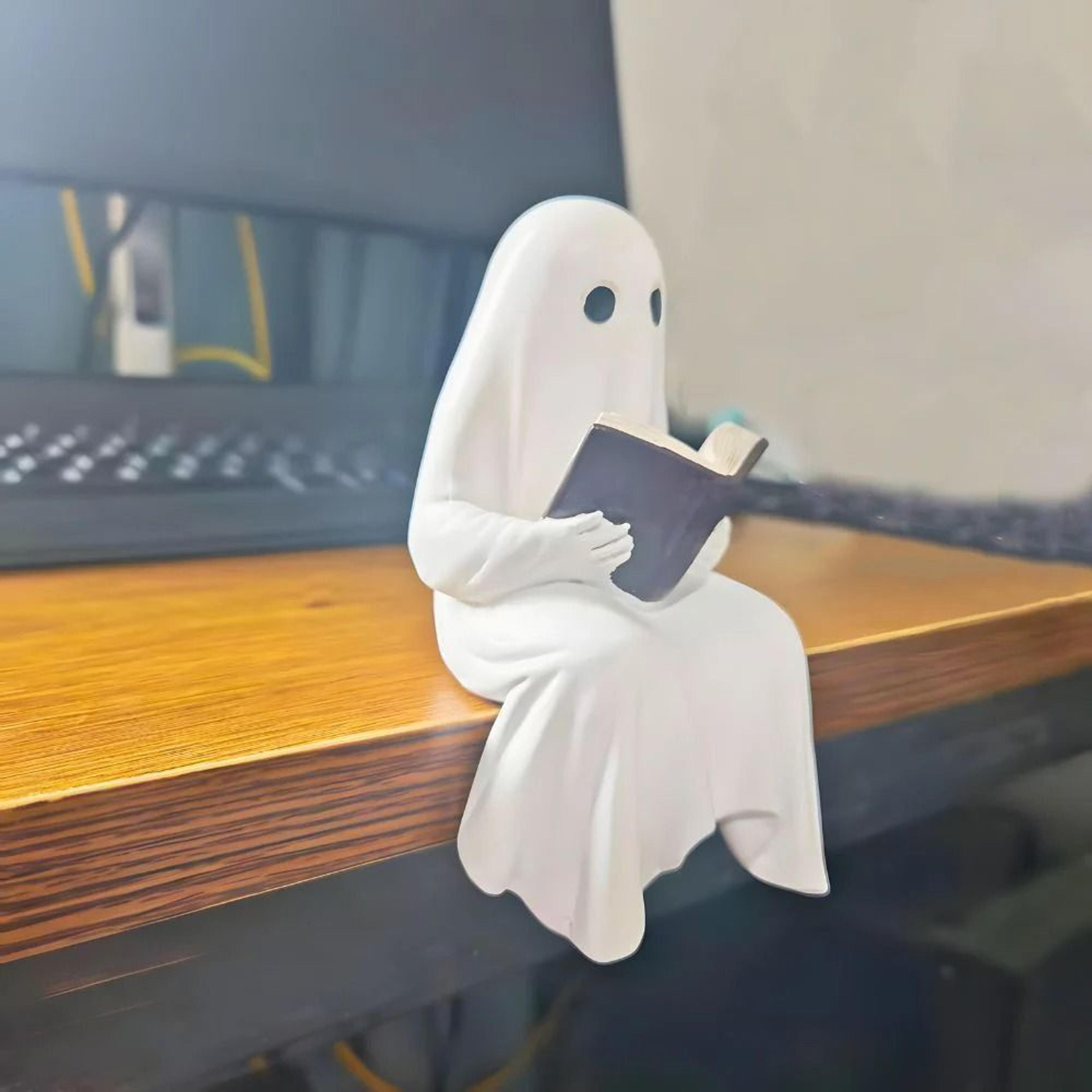 reading ghost resin figurine for book lovers
