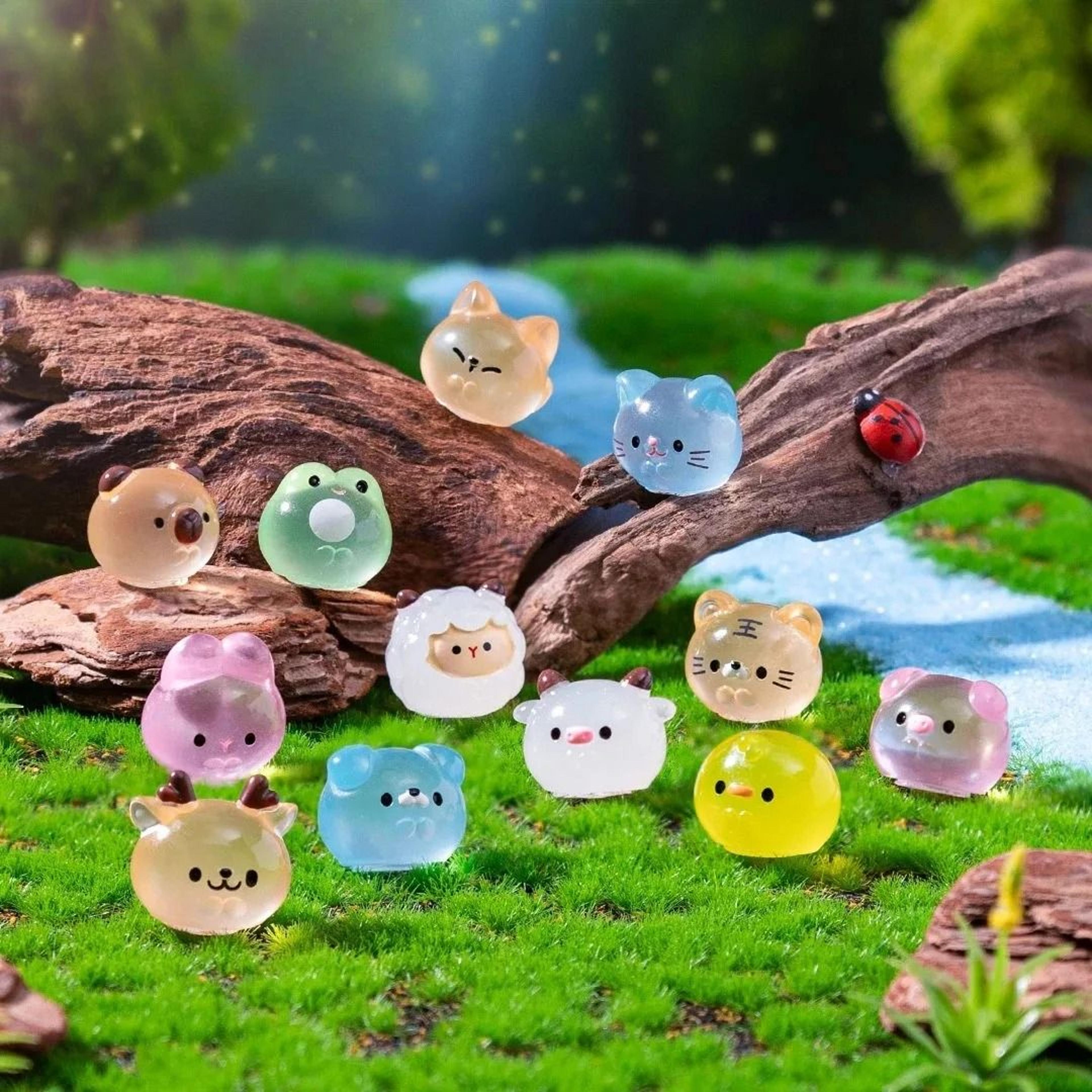 twelve luminous resin animal figurines create magical miniature garden scenes nightly