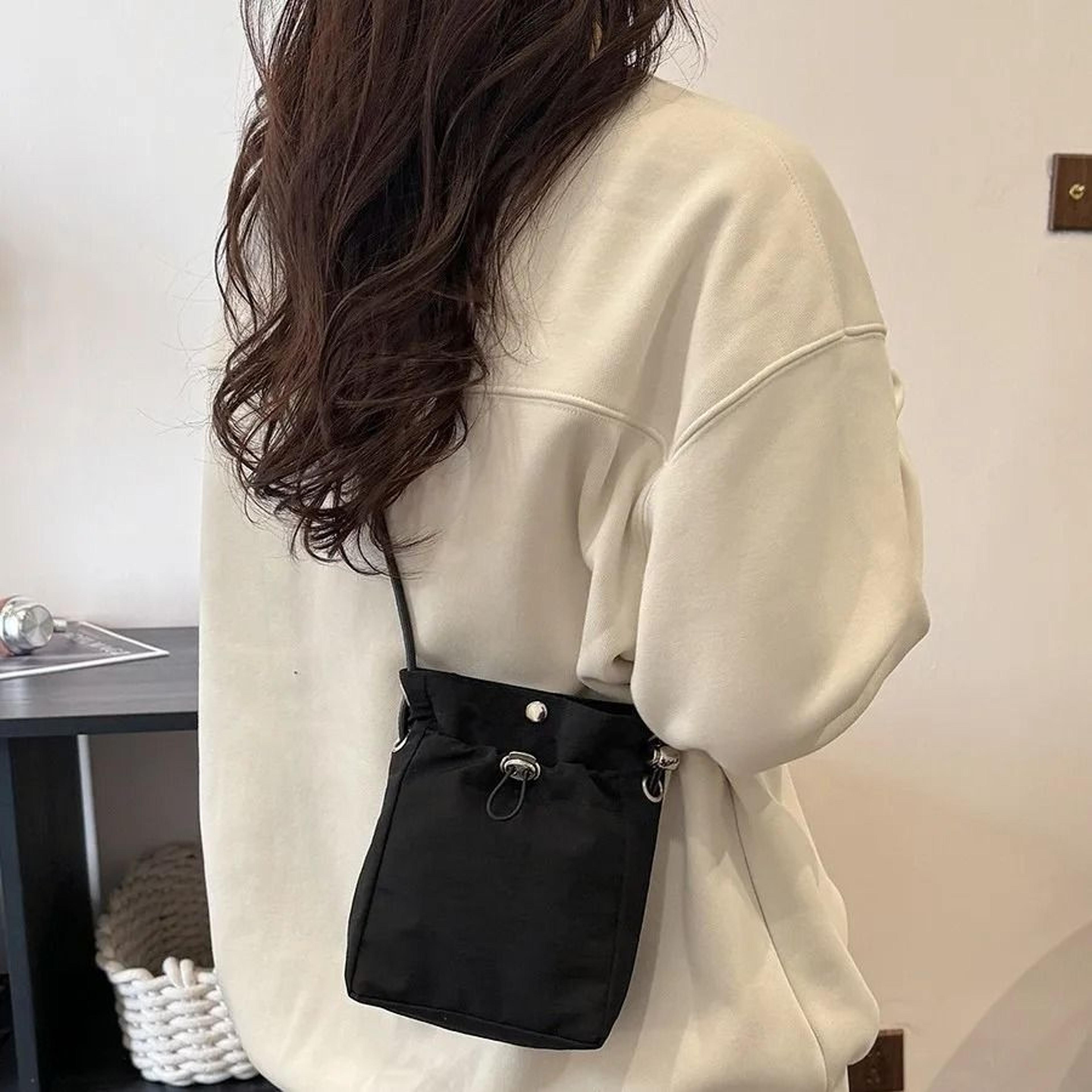 soft nylon crossbody phone bag keeps everyday essentials close and organized