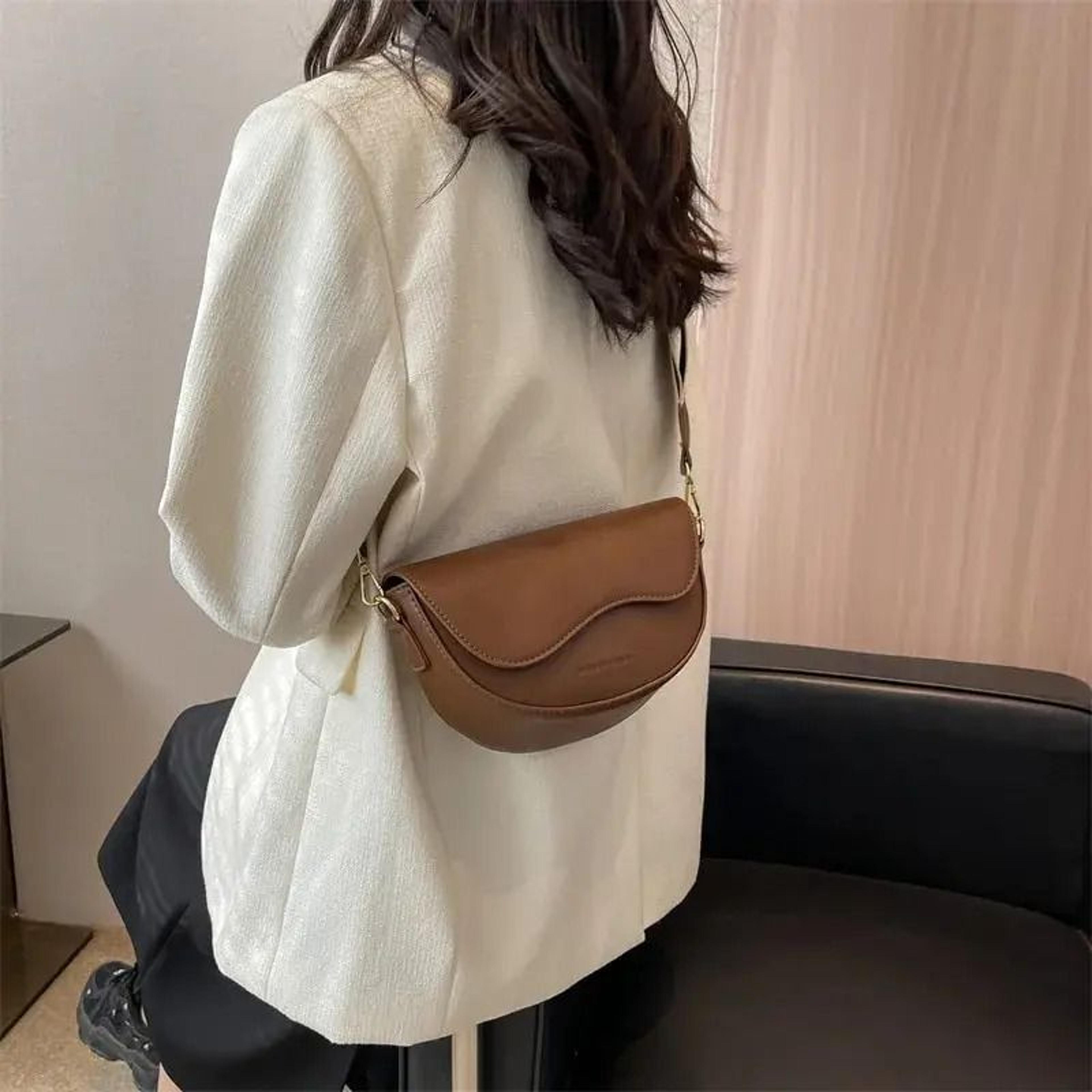 vintage saddle crossbody bag with wide strap for effortless everyday style