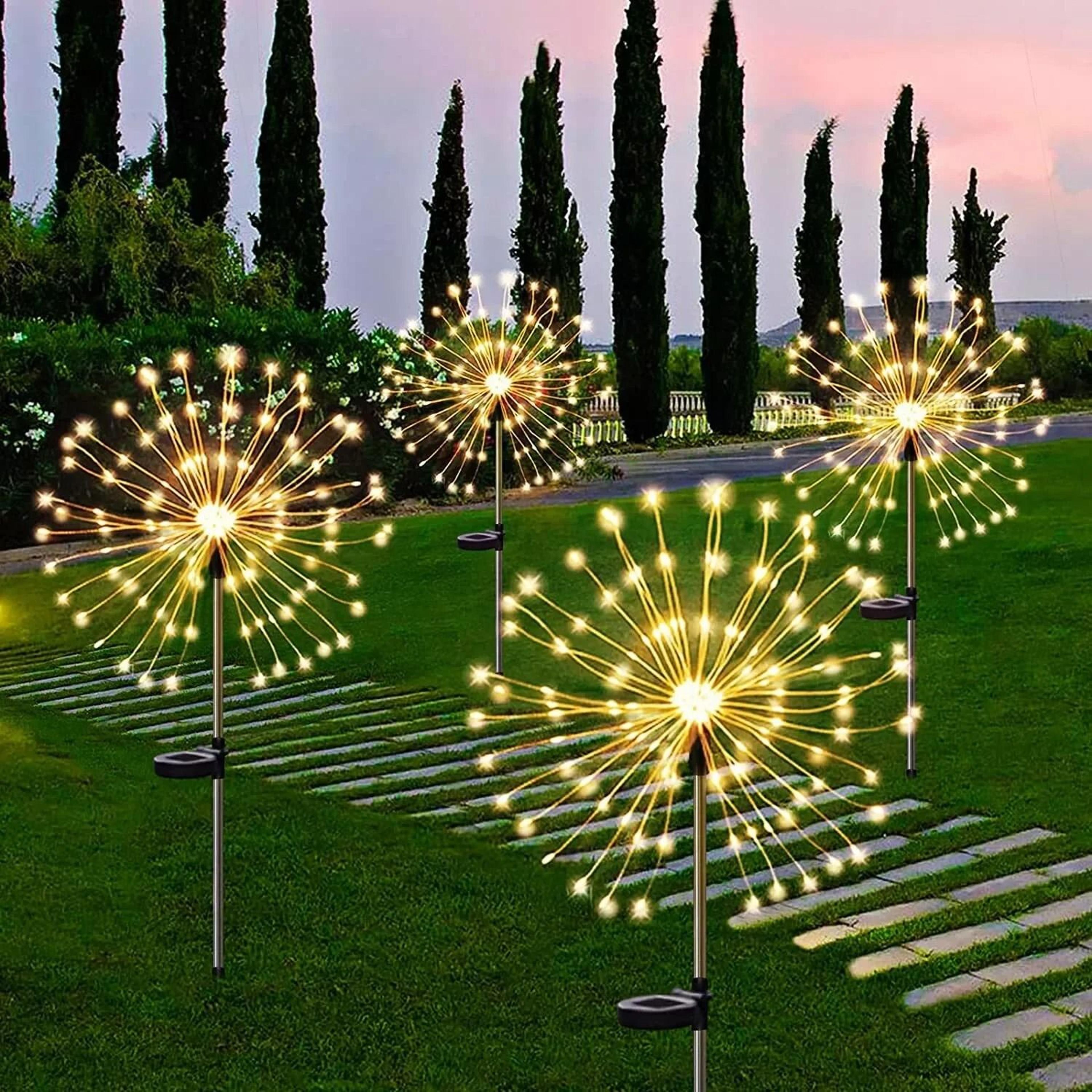 solar firework garden stake lights create sparkling outdoor displays every night