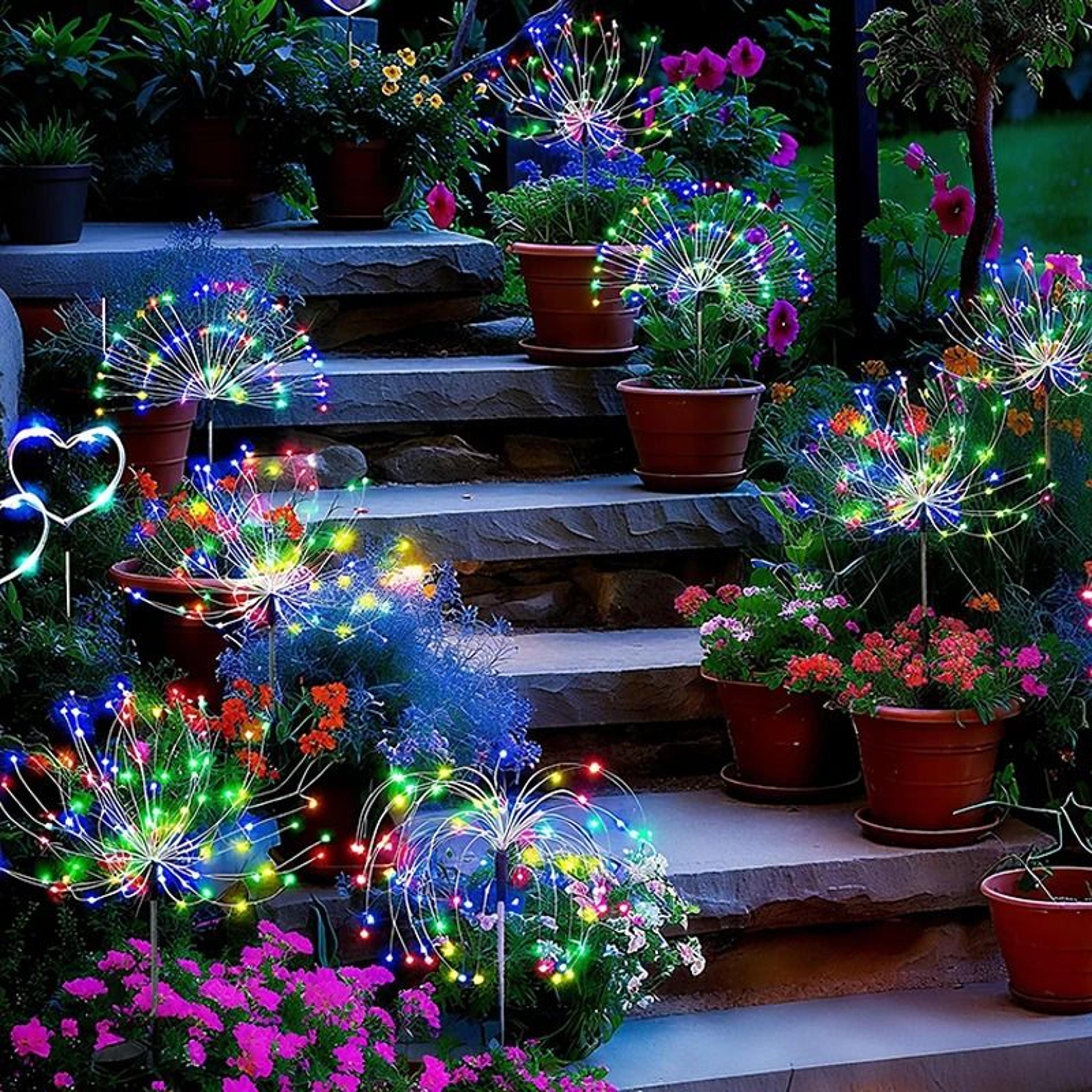 solar firework garden stake lights create sparkling outdoor displays every evening