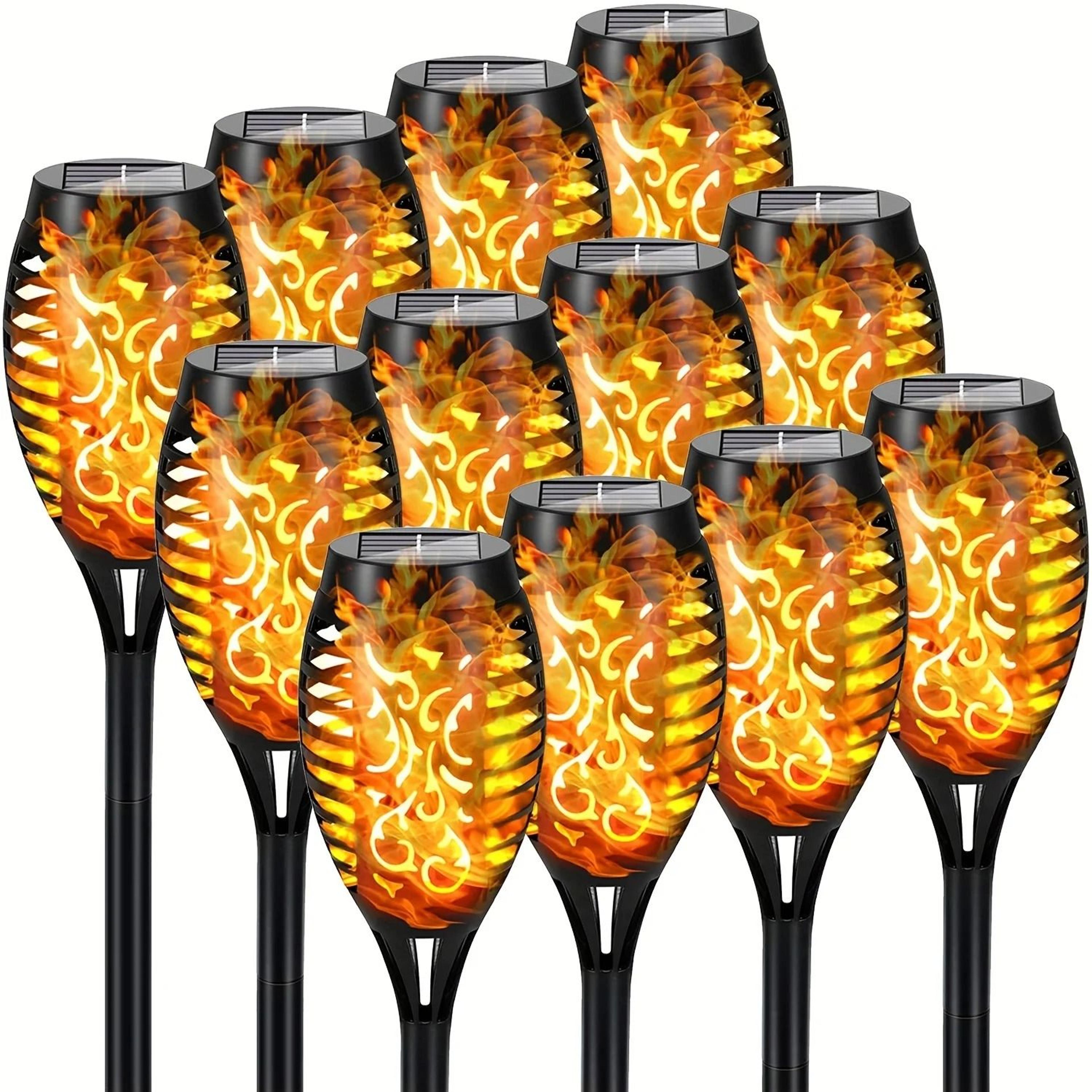 solar flame torch lights create warm flickering glow for outdoor gardens